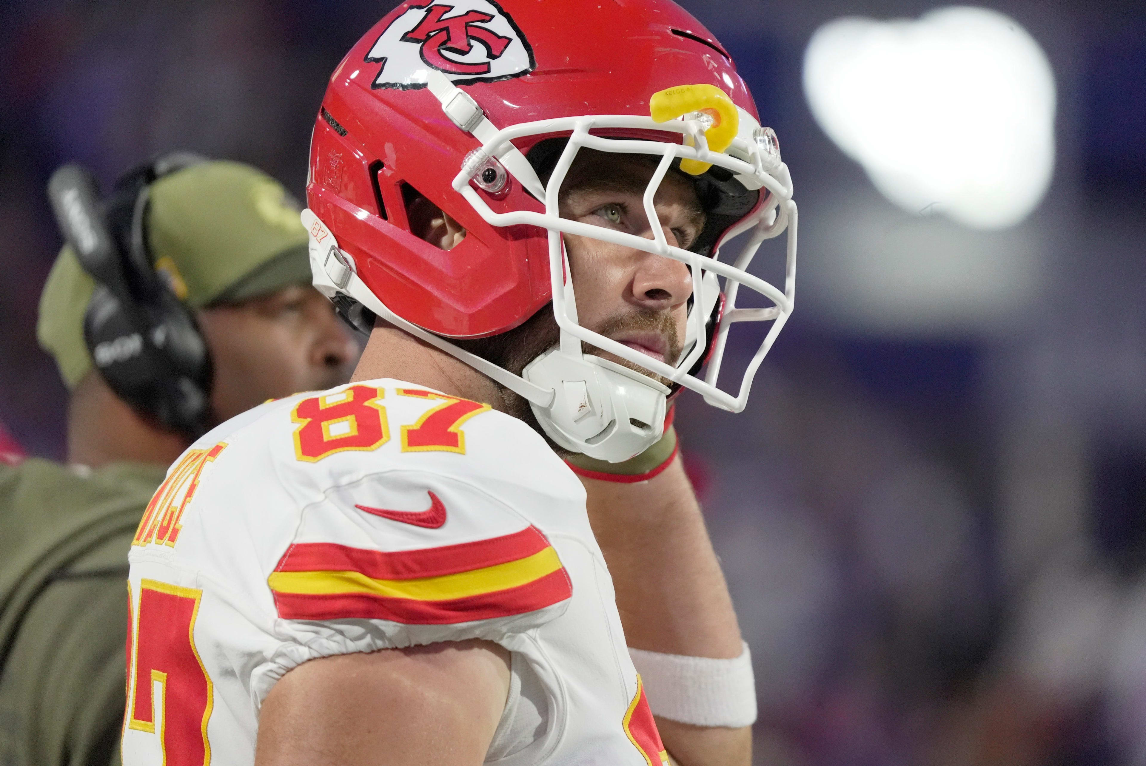 Kansas City Chiefs tight end Travis Kelce puts on his helmet getting ready to take the field