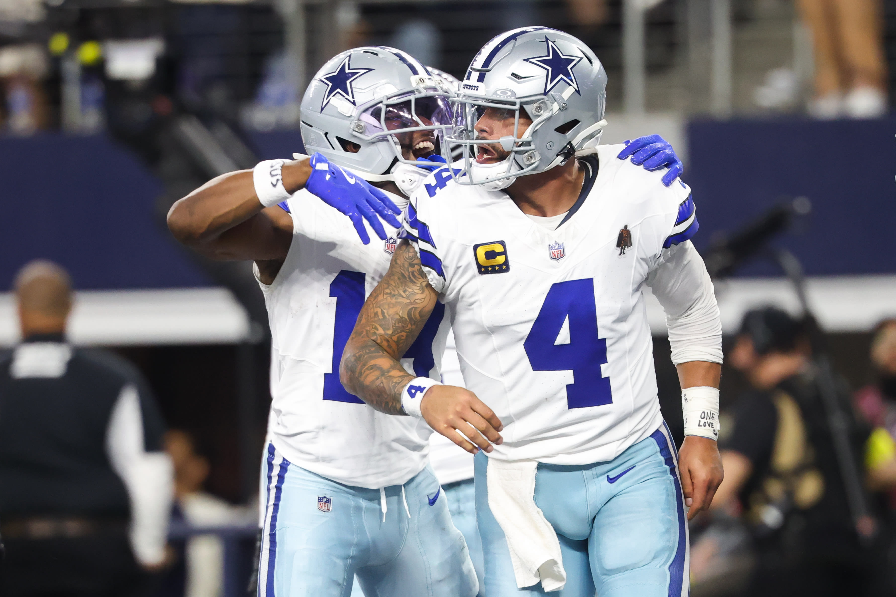 Nov 23, 2025; Arlington, Texas, USA; Dallas Cowboys quarterback Dak Prescott (4) celebrates a touchdown in the fourth quarter against the Philadelphia Eagles at AT&T Stadium. 
