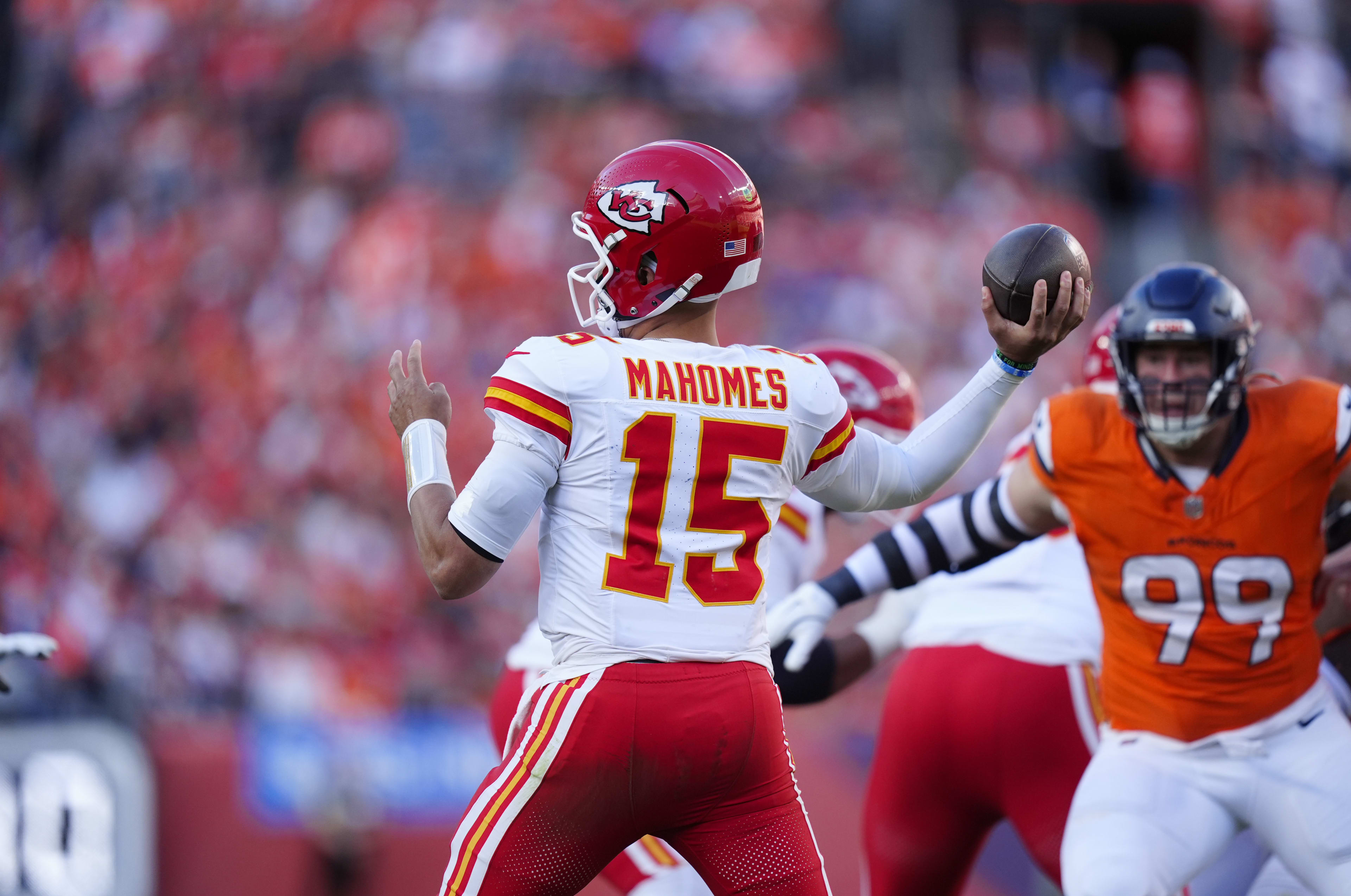 Nov 16, 2025; Denver, Colorado, USA; Kansas City Chiefs quarterback Patrick Mahomes (15) prepares to pass in the first half against the Denver Broncos at Empower Field at Mile High. Mandatory Credit: Ron Chenoy-Imagn Images
