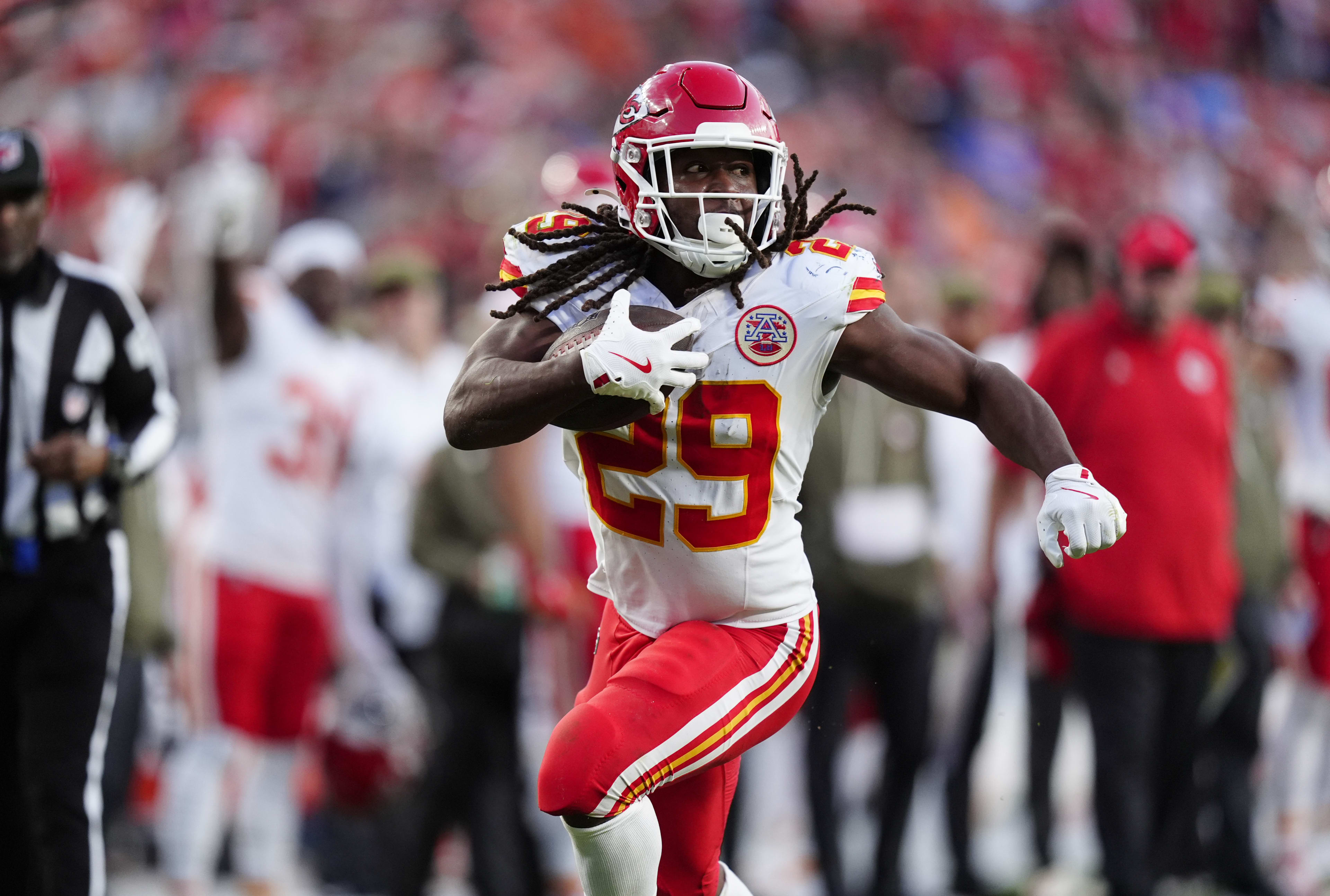 Nov 16, 2025; Denver, Colorado, USA; Kansas City Chiefs running back Kareem Hunt (29) carries the ball in the third quarter against the Denver Broncos at Empower Field at Mile High. 
