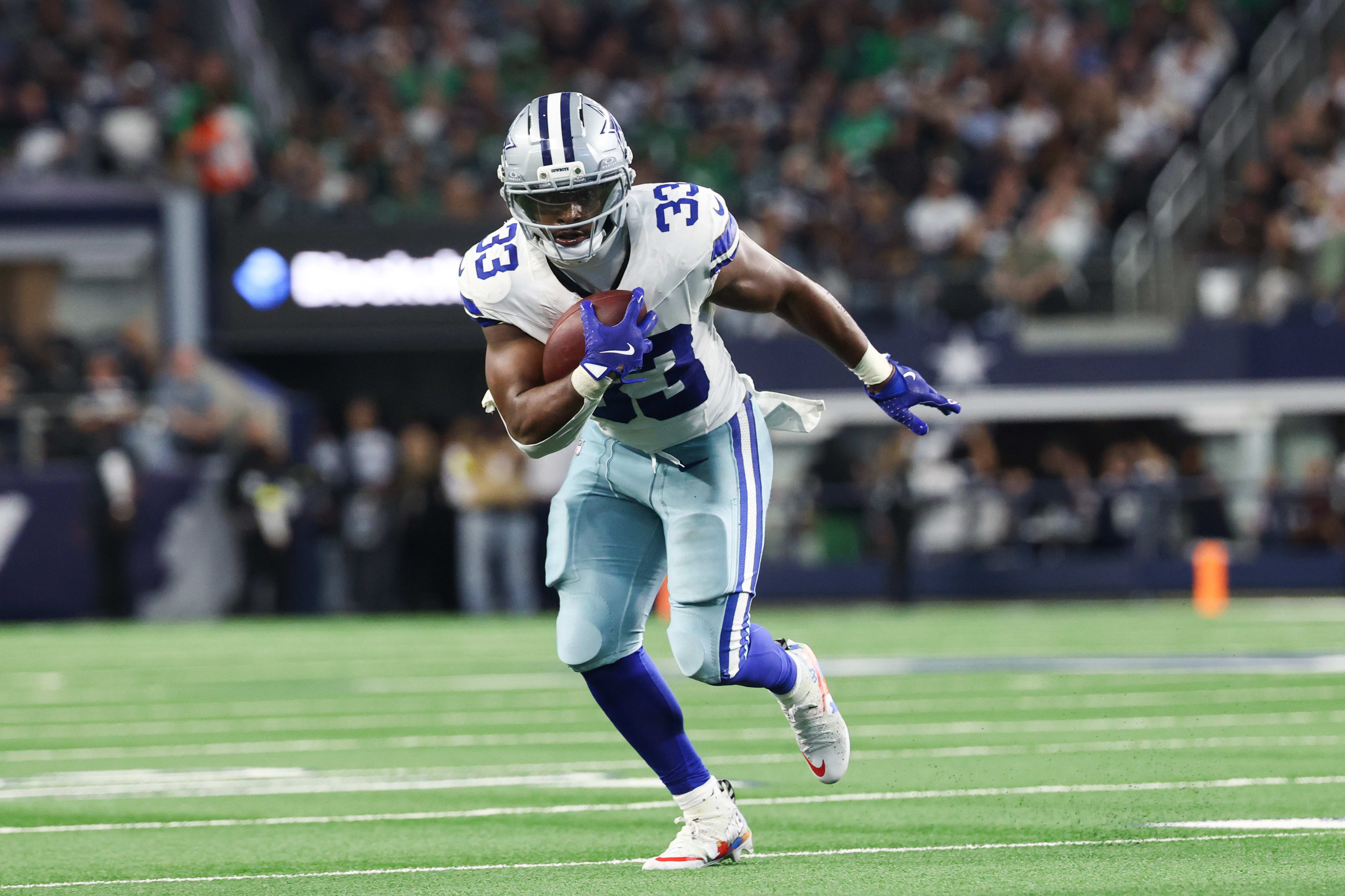 Nov 23, 2025; Arlington, Texas, USA; Dallas Cowboys running back Javonte Williams (33) runs with the ball in the second quarter against the Philadelphia Eagles at AT&T Stadium.