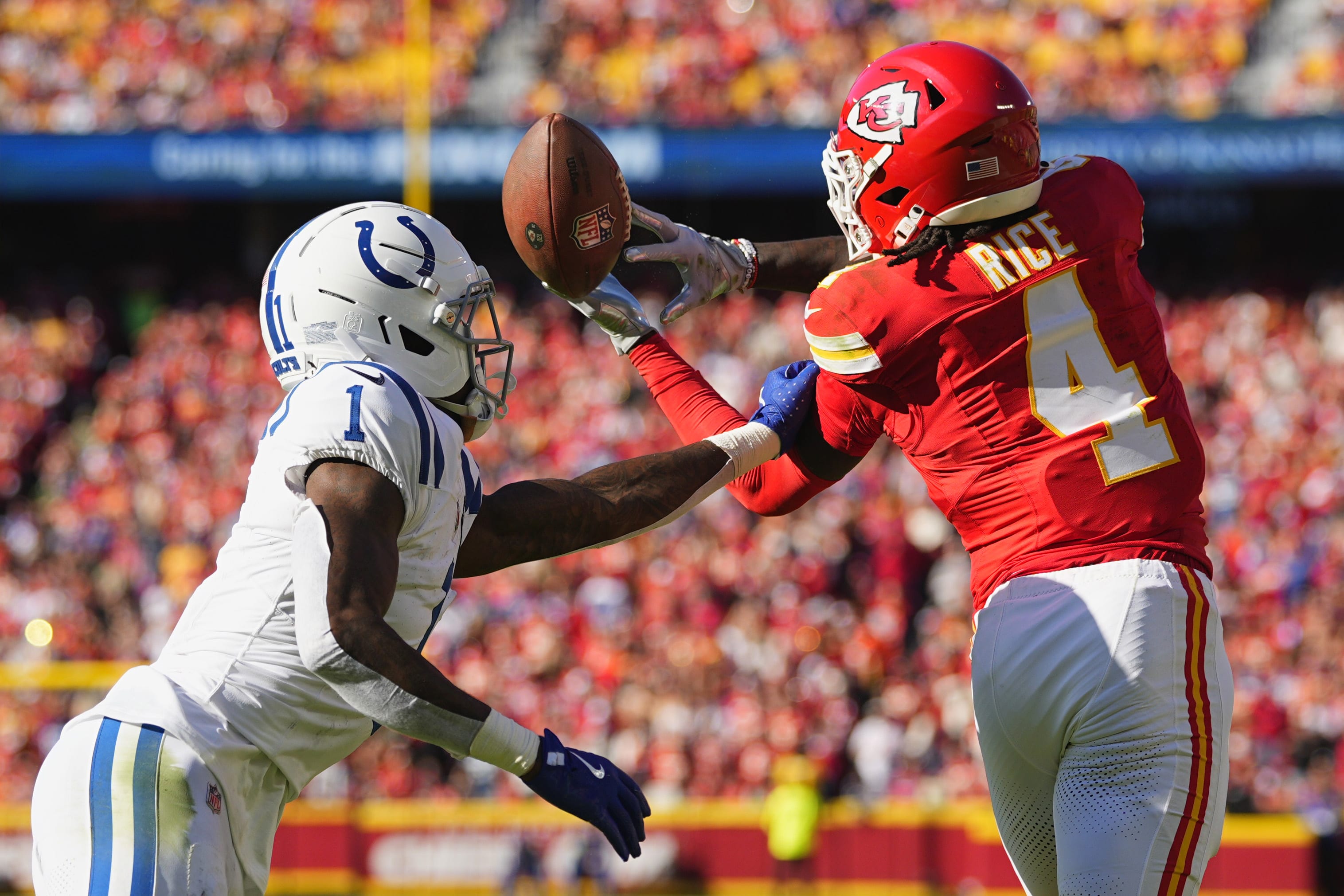 Nov 23, 2025; Kansas City, Missouri, USA;  Kansas City Chiefs wide receiver Rashee Rice (4) cannot make a catch against Indianapolis Colts cornerback Sauce Gardner (1) in the first half at GEHA Field at Arrowhead Stadium.
