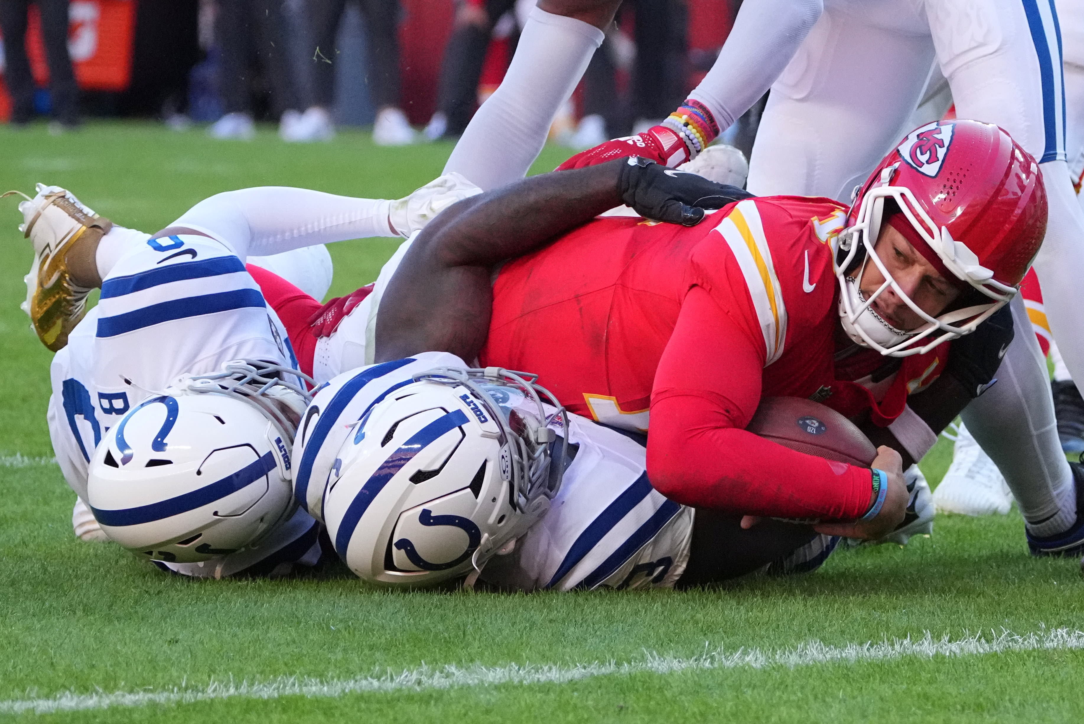 Nov 23, 2025; Kansas City, Missouri, USA; Indianapolis Colts linebacker Germaine Pratt (53) tackles Kansas City Chiefs quarterback Patrick Mahomes (15) in the second half at GEHA Field at Arrowhead Stadium. 
