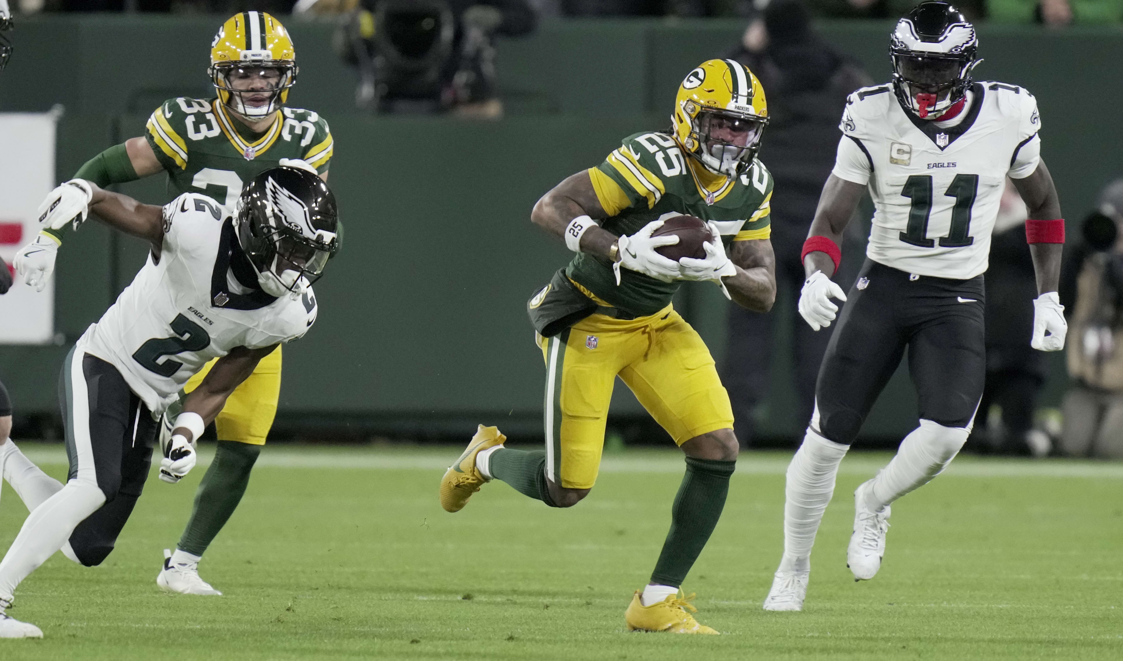 Nov 10, 2025; Green Bay, Wisconsin, USA; Green Bay Packers cornerback Keisean Nixon (25) recovers a fumble by Philadelphia Eagles quarterback Jalen Hurts during the first half at Lambeau Field.