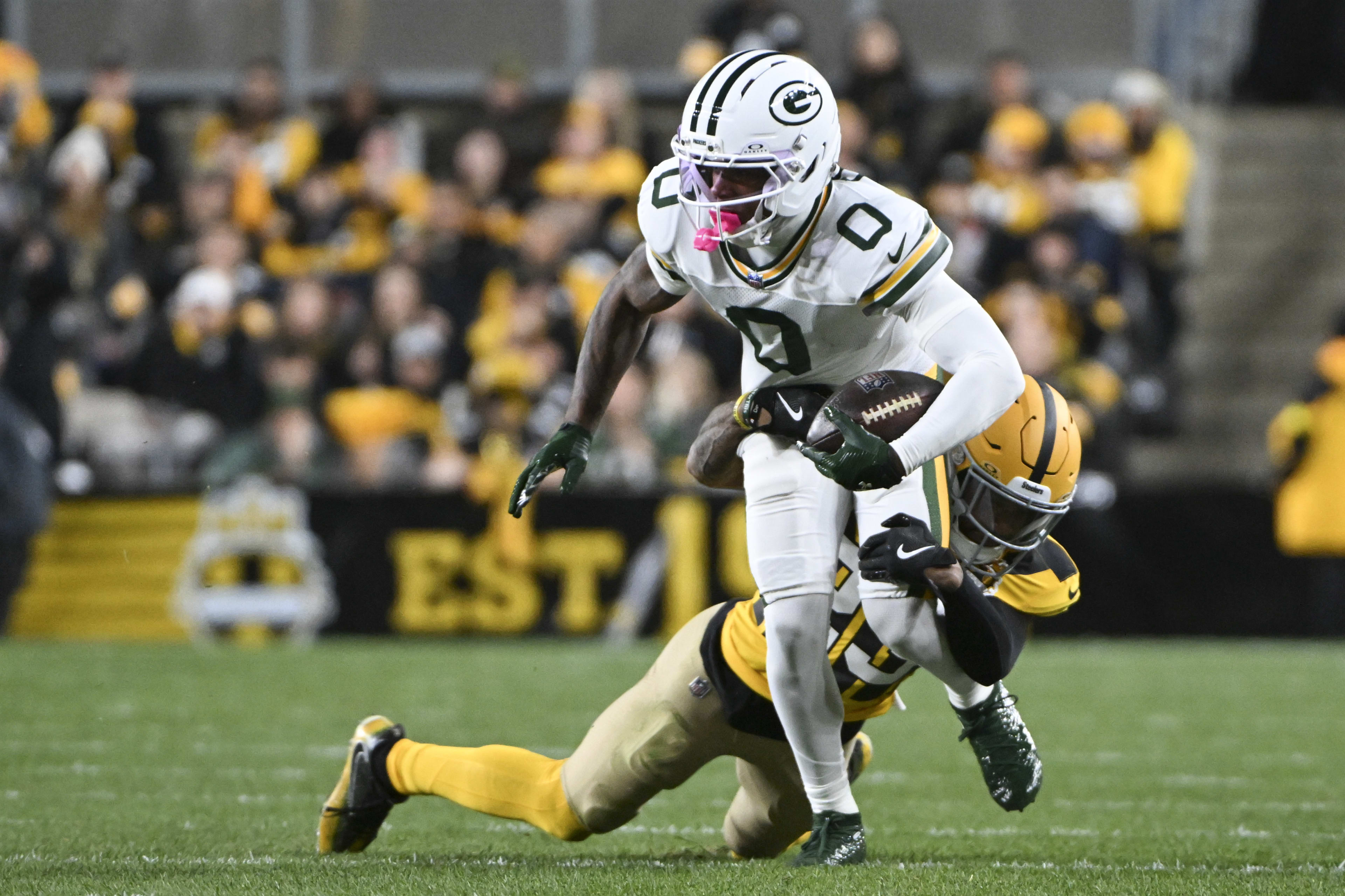 Oct 26, 2025; Pittsburgh, Pennsylvania, USA; Green Bay Packers wide receiver Matthew Golden is tackled by Pittsburgh Steelers cornerback Darius Slay (23) during the first quarter at Acrisure Stadium.