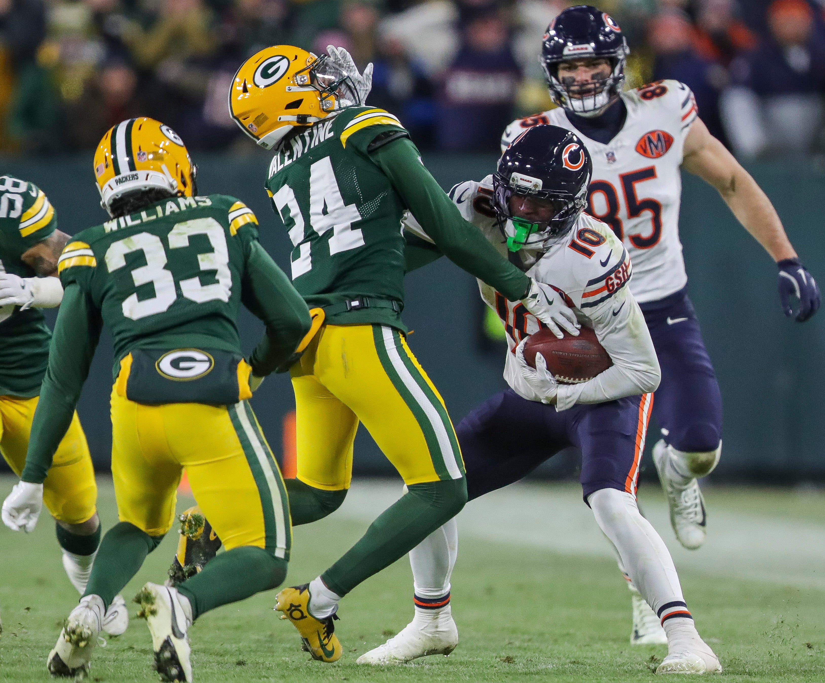 Chicago Bears wide receiver Luther Burden III (10) stiff-arms Green Bay Packers cornerback Carrington Valentine (24) on Sunday, December 7, 2025, at Lambeau Field in Green Bay, Wis. The Packers won the game, 28-21.