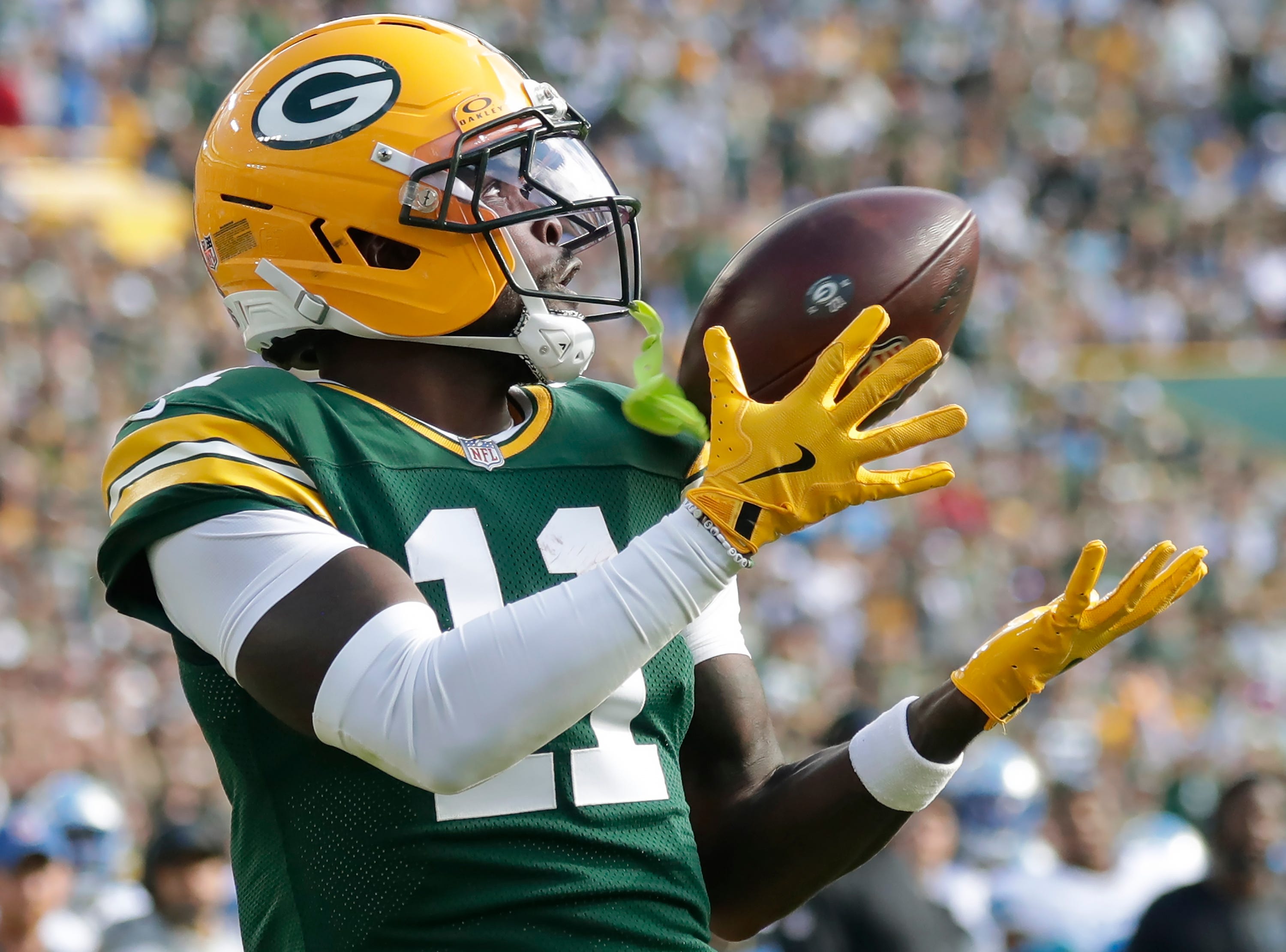 Green Bay Packers wide receiver Jayden Reed (11) catches a second quarter touchdown pass against the Detroit Lions on Sunday, September 7, 2025, at Lambeau Field in Green Bay, Wis.