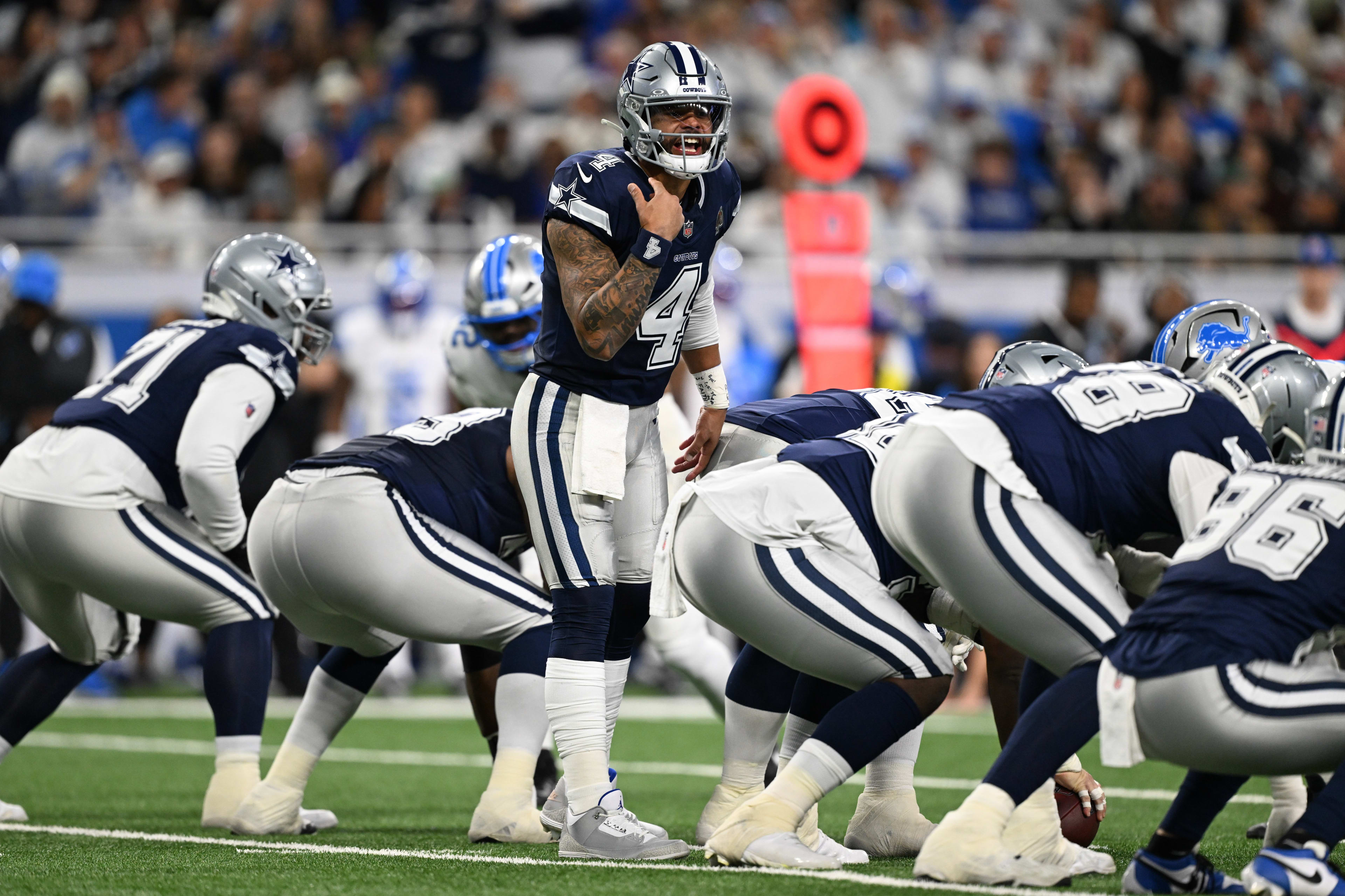 Dec 4, 2025; Detroit, Michigan, USA; Dallas Cowboys quarterback Dak Prescott (4) audibles during the first half against the Detroit Lions at Ford Field.