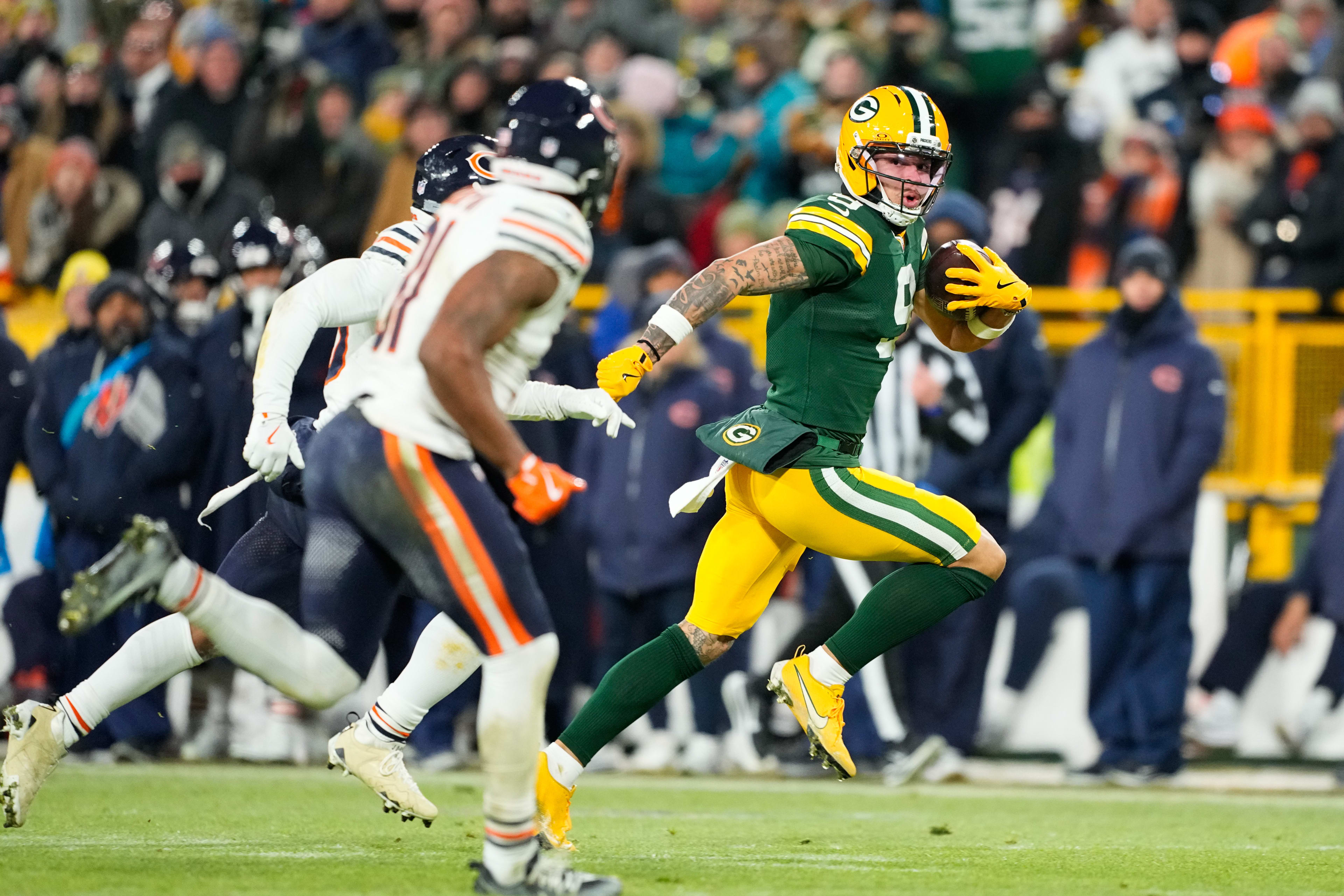Dec 7, 2025; Green Bay, Wisconsin, USA; Green Bay Packers wide receiver Christian Watson (9) runs with the ball during the third quarter against the Chicago Bears at Lambeau Field.