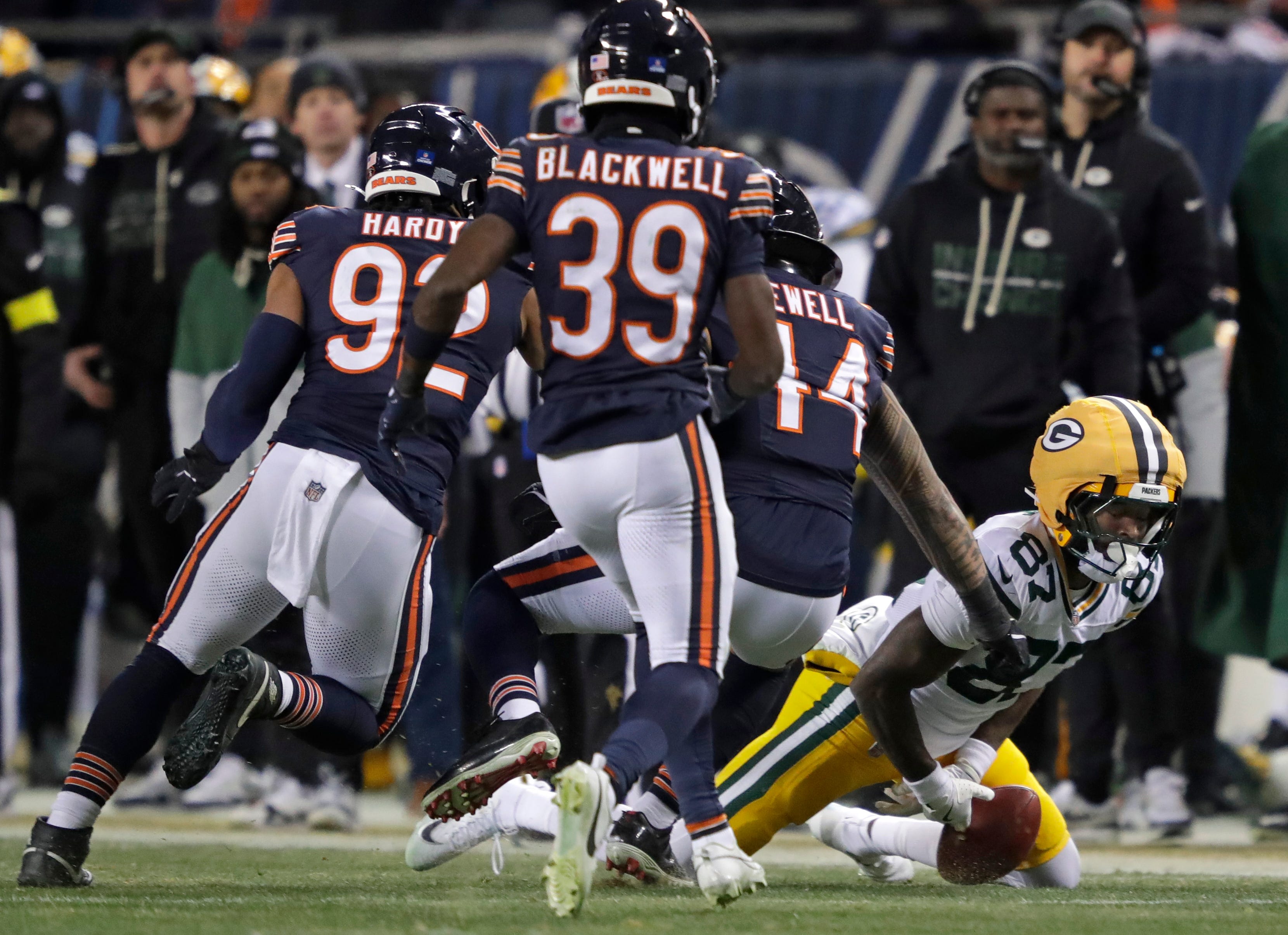 Green Bay Packers wide receiver Romeo Doubs (87) mishandles an onside kick as Chicago Bears cornerback Josh Blackwell (39) moves in to recover the ball during their football game Saturday, December 20, 2025, at Soldier Field in Chicago, Illinois.
