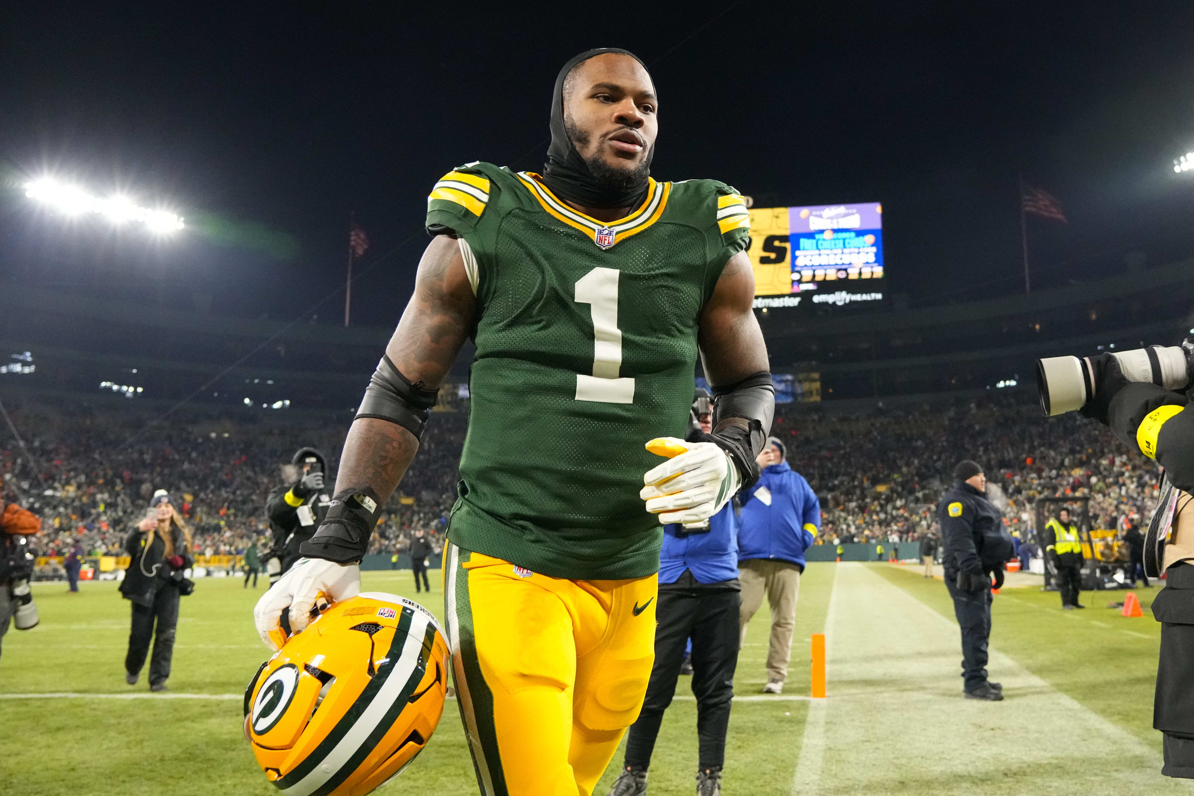 Dec 7, 2025; Green Bay, Wisconsin, USA; Green Bay Packers defensive end Micah Parsons (1) jogs off the field following the game against the Chicago Bears at Lambeau Field.