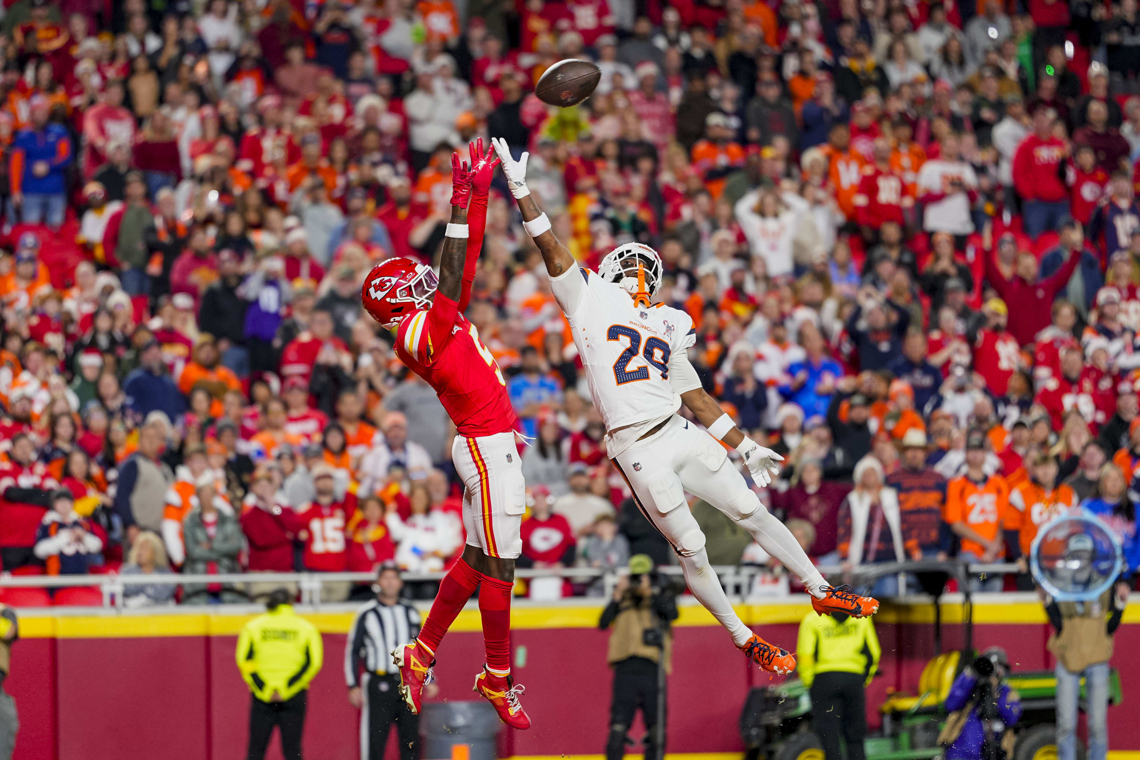 Dec 25, 2025; Kansas City, Missouri, USA; Kansas City Chiefs wide receiver Hollywood Brown (5) misses a catch against Kansas City Chiefs running back Kareem Hunt (29) at GEHA Field at Arrowhead Stadium. 
