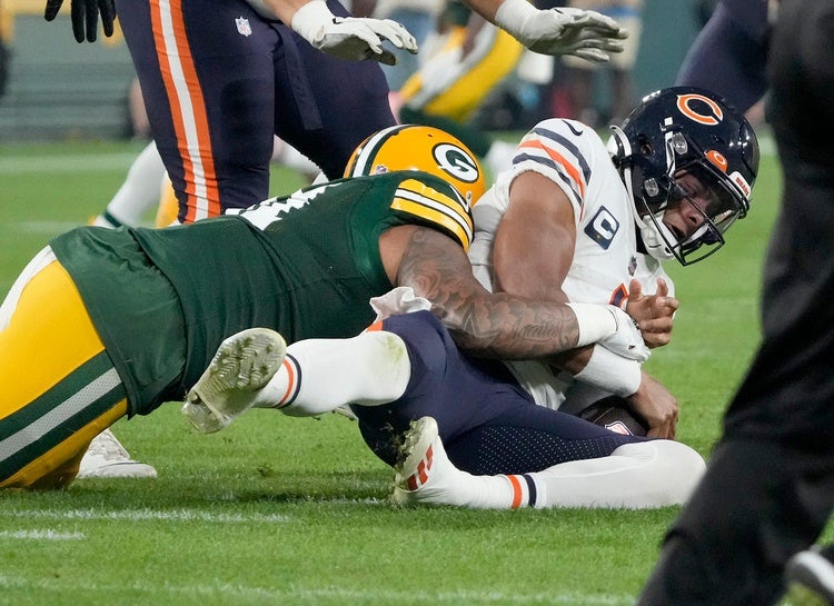 Green Bay Packers linebacker Preston Smith (91) sacks Chicago Bears quarterback Justin Fields (1) during the second quarter of their game on Sunday, Sept. 18, 2022 at Lambeau Field in Green Bay. Packers Bears Packers19 2028