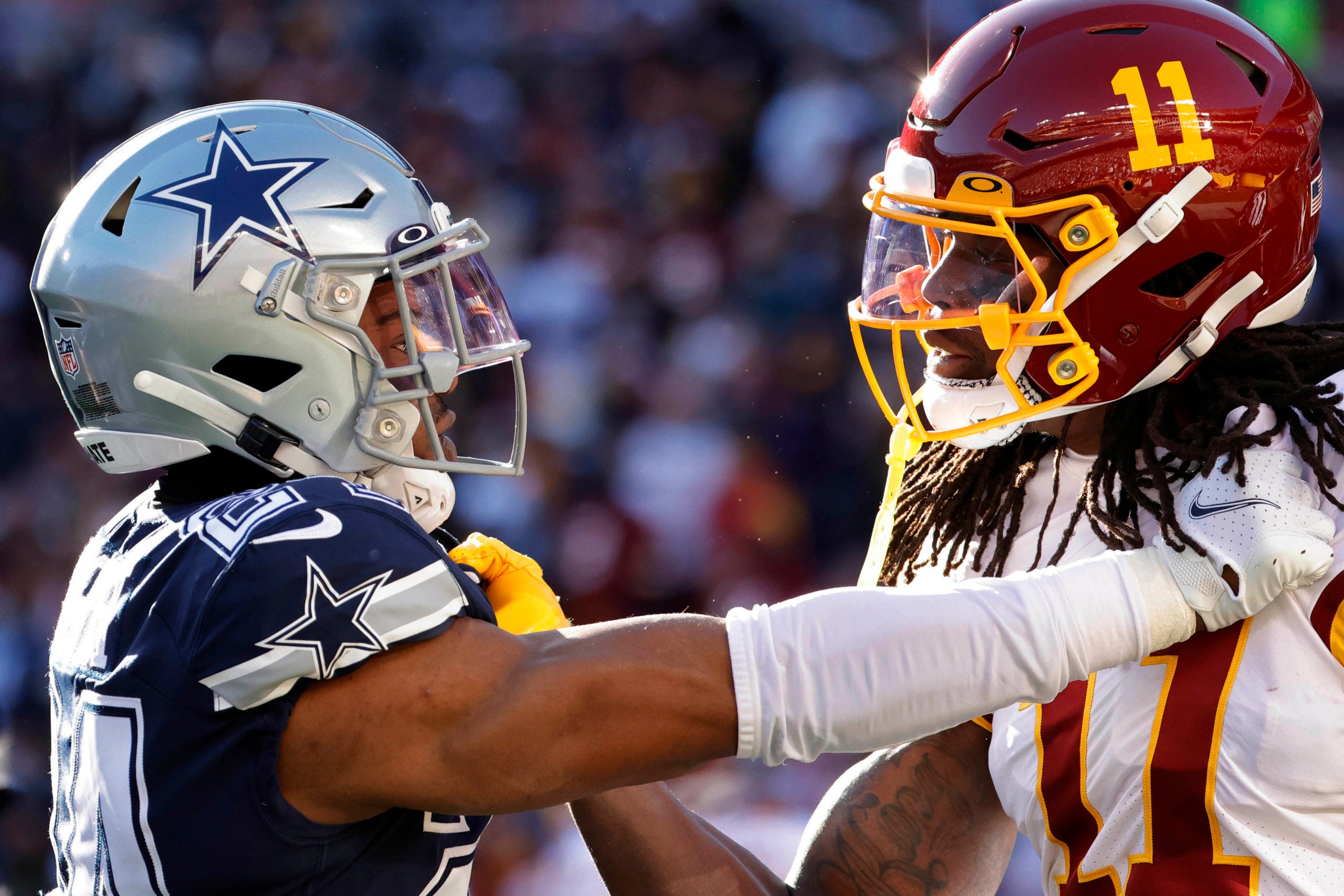 Dec 12, 2021; Landover, Maryland, USA; Dallas Cowboys cornerback Kelvin Joseph (24) exchanges words with Washington Football Team wide receiver Cam Sims (11) at FedExField. Mandatory Credit: Geoff Burke-USA TODAY Sports