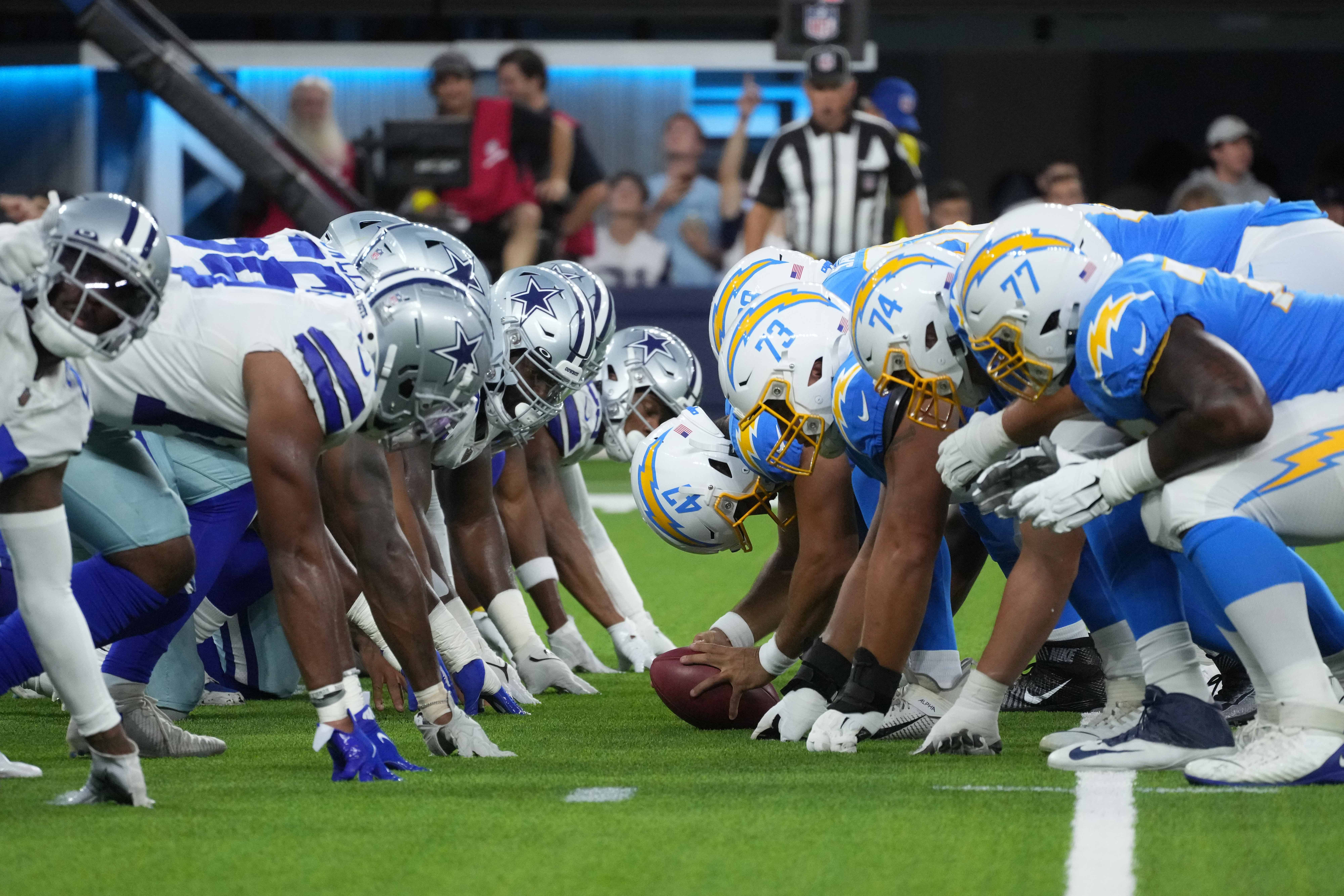 Aug 20, 2022; Inglewood, California, USA; A general overall view of helmets at the line of scrimmage as Los Angeles Chargers long snapper Josh Harris (47) snaps the ball against the Dallas Cowboys at SoFi Stadium. Mandatory Credit: Kirby Lee-USA TODAY Sports