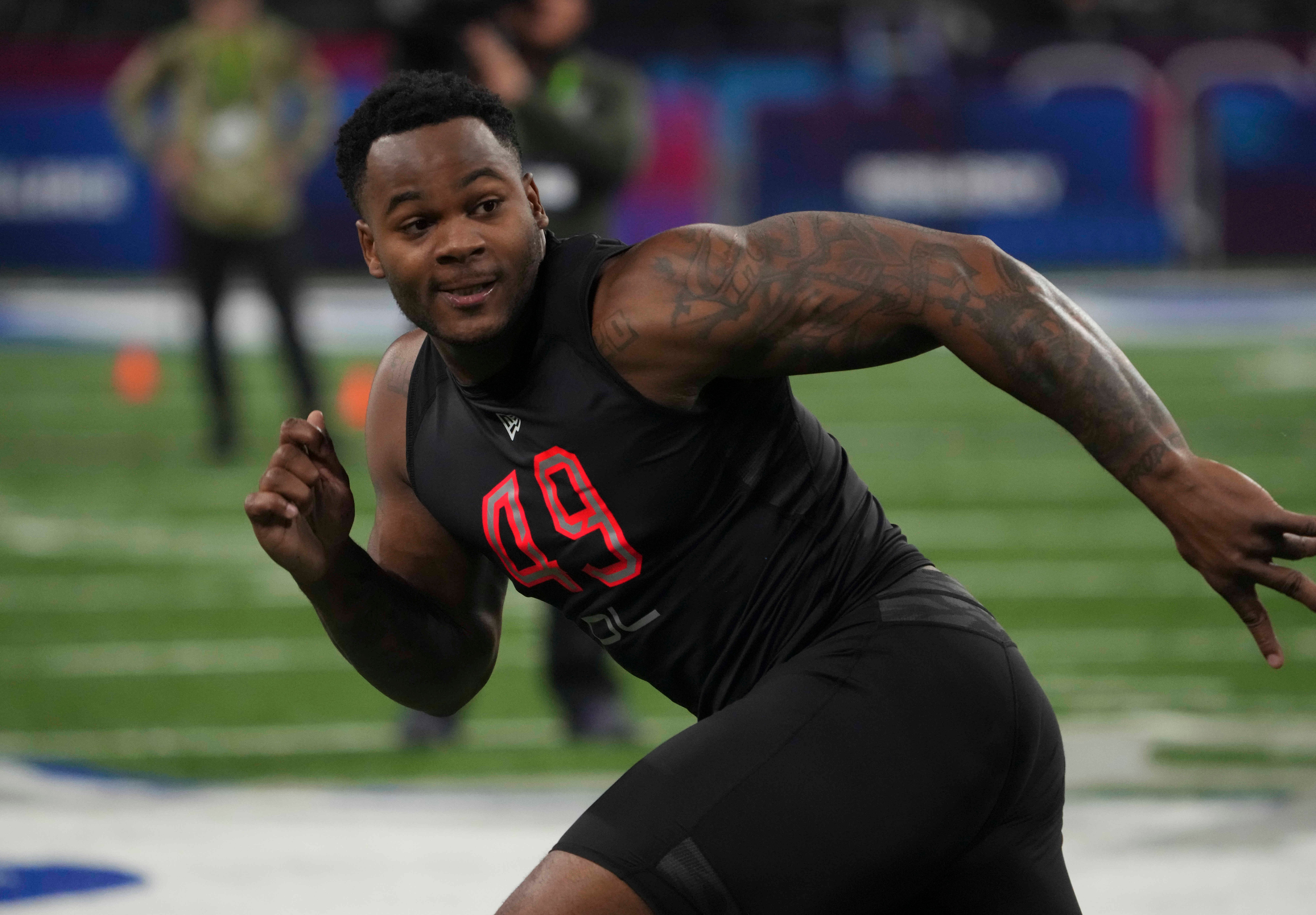 Mar 5, 2022; Indianapolis, IN, USA; Mississippi defensive lineman Sam Williams (DL49) goes through drills during the 2022 NFL Scouting Combine at Lucas Oil Stadium. Mandatory Credit: Kirby Lee-USA TODAY Sports