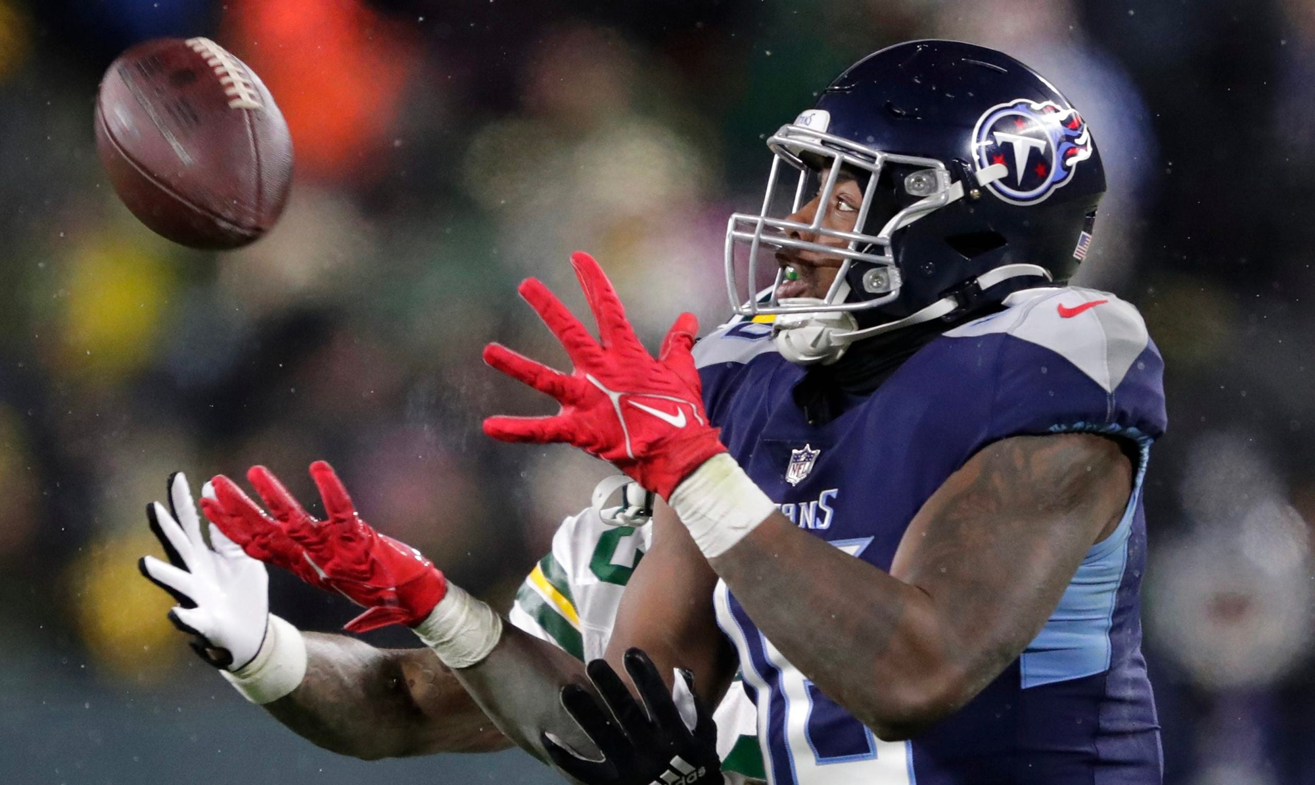 Tennessee Titans wide receiver Treylon Burks (16) pulls down a long first down reception against Green Bay Packers cornerback Jaire Alexander (23) late in the fourth quarter during their football game Thursday, November 17, at Lambeau Field in Green Bay, Wis. Dan Powers/USA TODAY NETWORK-Wisconsin Apc Packvstitans 1117221647djp