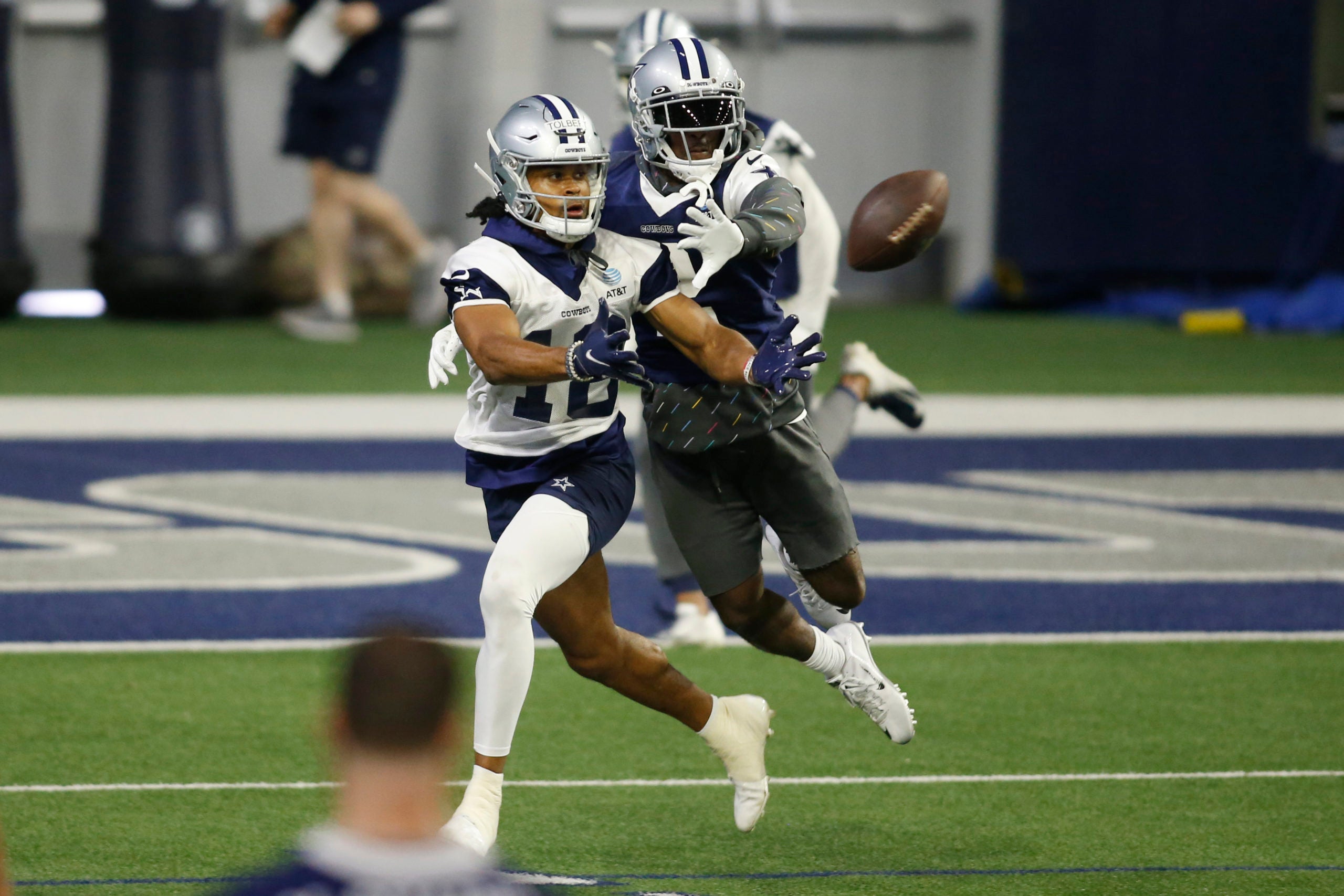 Jun 14, 2022; Arlington, Texas, USA;  Dallas Cowboys cornerback Jourdan Lewis (2) and wide receiver Jalen Tolbert (18) go through a drill during minicamp at the Ford Center at the Star Training Facility in Frisco, Texas. Mandatory Credit: Tim Heitman-USA TODAY Sports