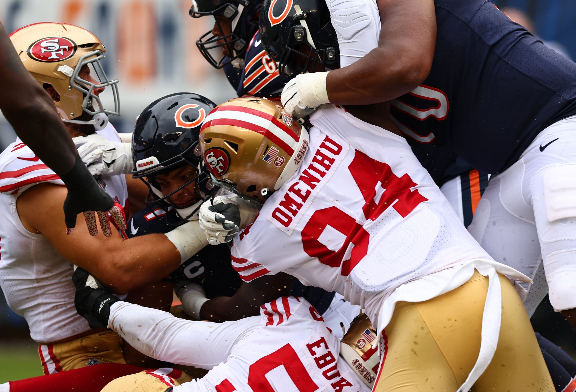 Sep 11, 2022; Chicago, Illinois, USA; San Francisco 49ers defensive end Charles Omenihu (94) hits Chicago Bears quarterback Justin Fields (1) during the first quarter at Soldier Field. Mandatory Credit: Mike Dinovo-USA TODAY Sports