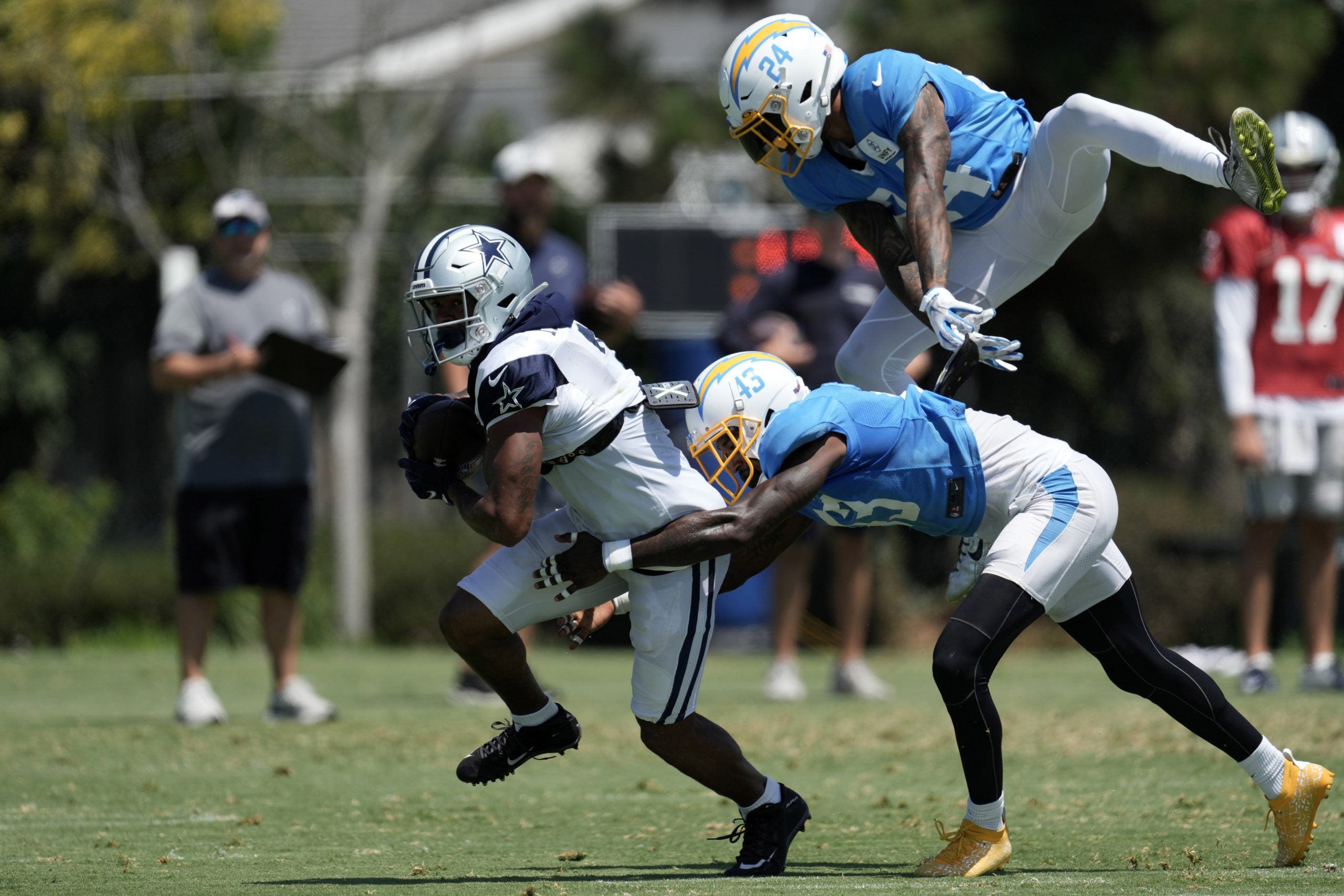 Aug 18, 2022; Costa Mesa, CA, USA; Dallas Cowboys wide receiver Dennis Houston (3) is pursued by Los Angeles Chargers cornerback Michael Davis (43) and safety Nasir Adderley (24) during joint practice at Jack Hammett Sports Complex. Mandatory Credit: Kirby Lee-USA TODAY Sports