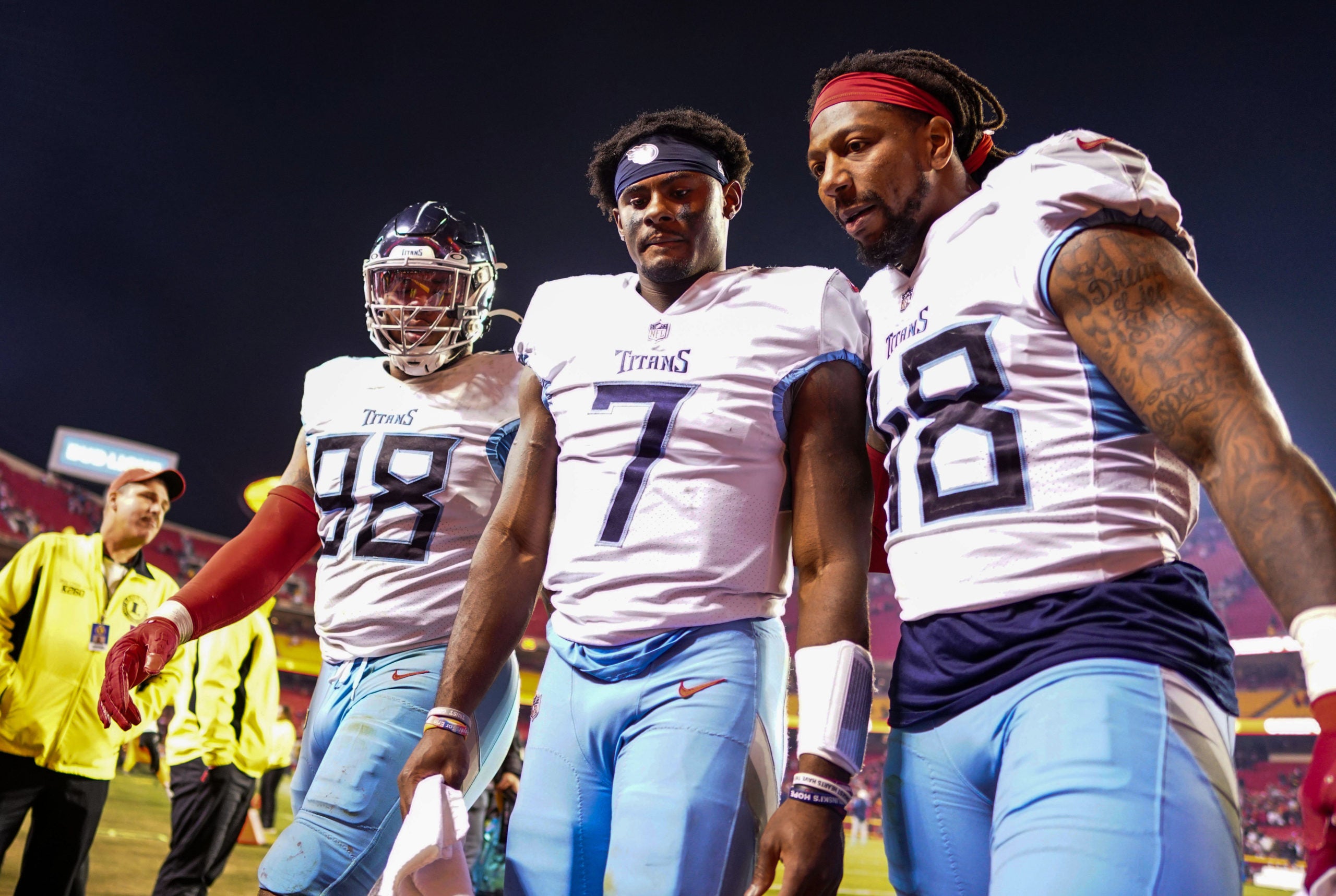 Nov 6, 2022; Kansas City, Missouri, USA; Tennessee Titans quarterback Malik Willis (7) leaves the field with defensive tackle Jeffery Simmons (98) and linebacker Bud Dupree (48) after a loss to the Kansas City Chiefs at GEHA Field at Arrowhead Stadium. Mandatory Credit: Jay Biggerstaff-USA TODAY Sports