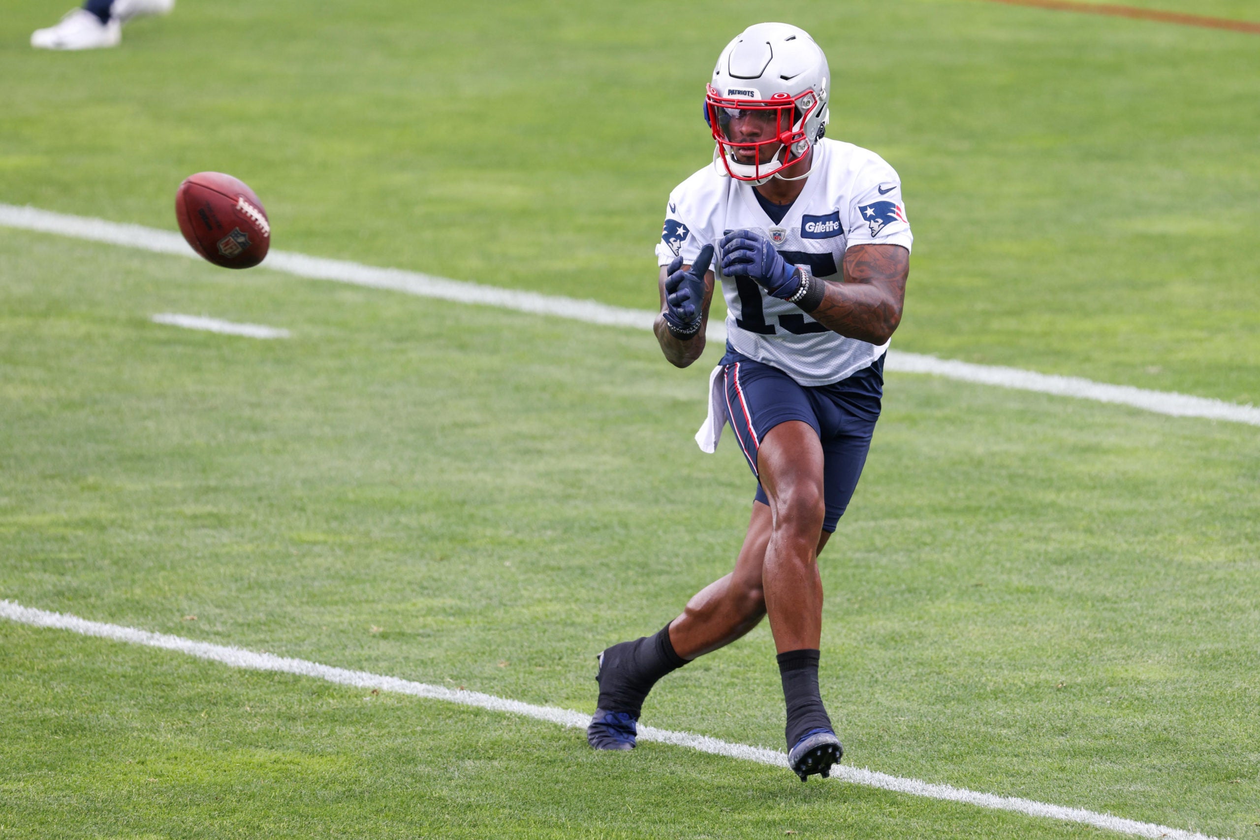 Jun 15, 2021; Foxborough, MA, USA; New England Patriots wide receiver NÕKeal Harry (15) participates in a drill during the New England Patriots mini camp at the New England Patriots practice complex. Mandatory Credit: Paul Rutherford-USA TODAY Sports