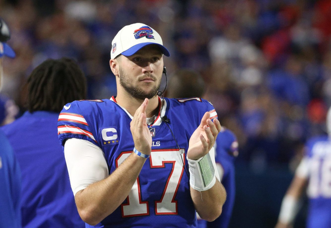 Bills quarterback Josh Allen cheers on teammates after coming out of the game in the third quarter in a 41-7 win. Credit © JAMIE GERMANO / USA TODAY NETWORK