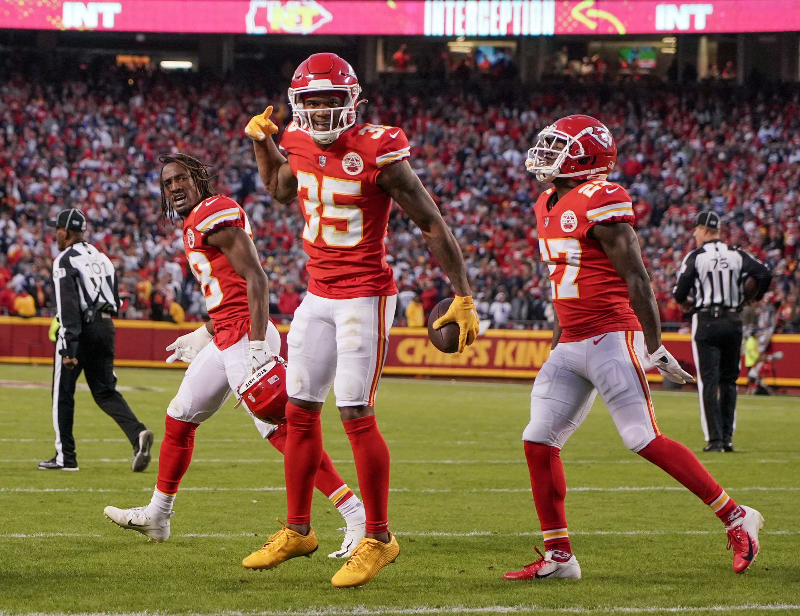Nov 21, 2021; Kansas City, Missouri, USA; Kansas City Chiefs cornerback Charvarius Ward (35) celebrates with cornerback L'Jarius Sneed (38) and cornerback Rashad Fenton (27) after intercepting a pass against the Dallas Cowboys during the game at GEHA Field at Arrowhead Stadium. Mandatory Credit: Denny Medley-USA TODAY Sports