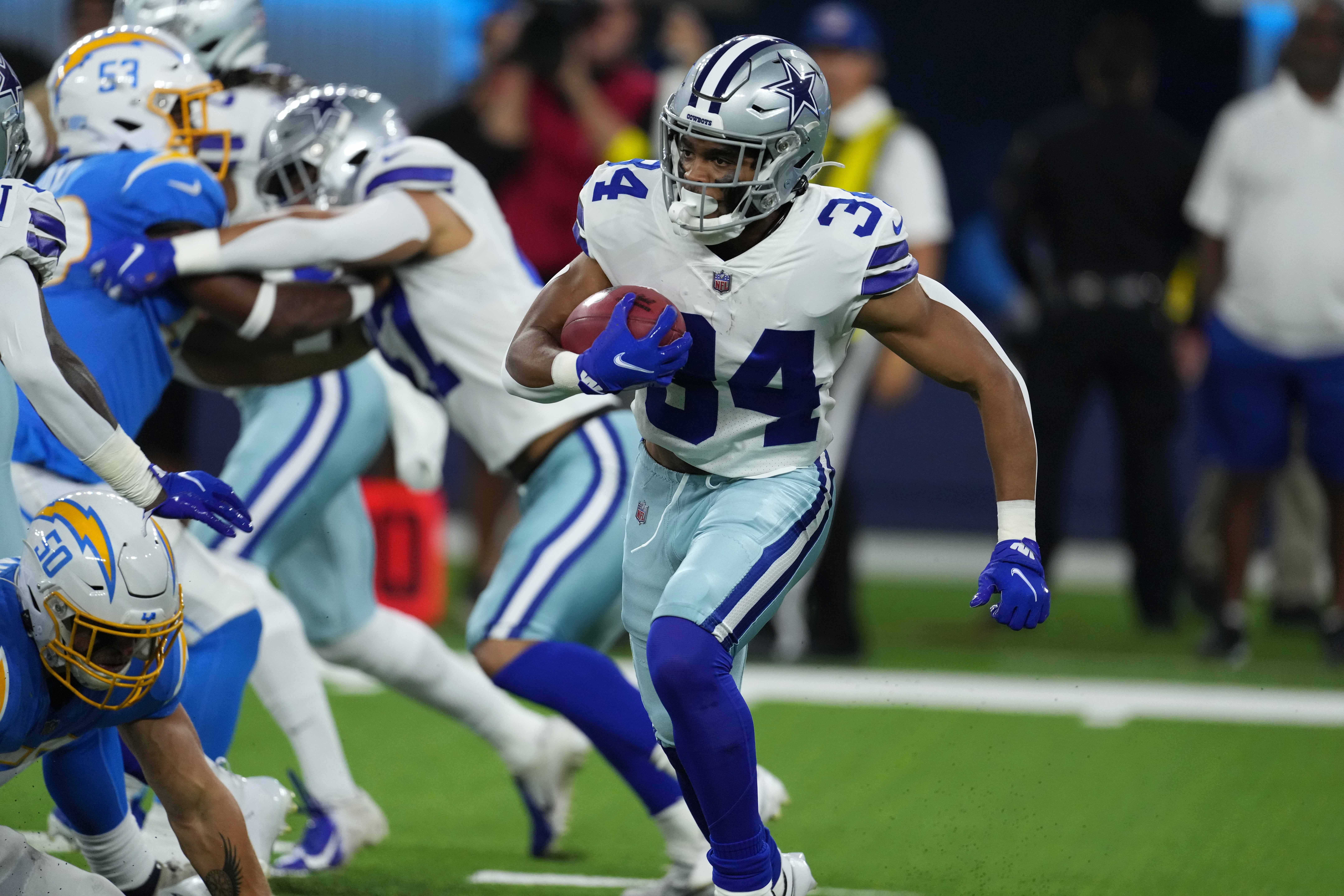 Aug 20, 2022; Inglewood, California, USA; Dallas Cowboys running back Malik Davis (34) carries the ball against the Los Angeles Chargers at SoFi Stadium. Mandatory Credit: Kirby Lee-USA TODAY Sports