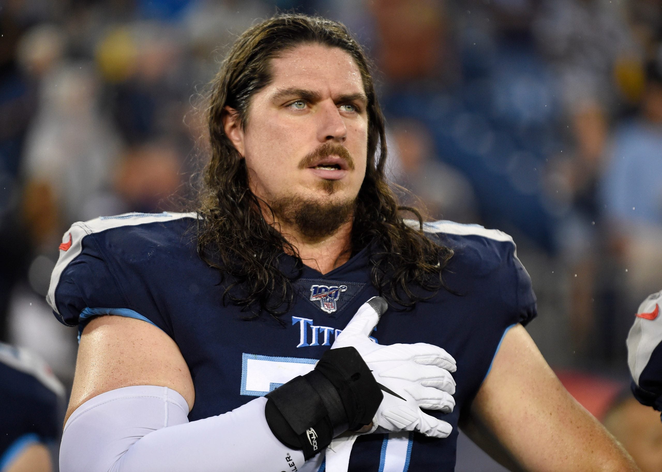 Tennessee Titans offensive tackle Dennis Kelly (71) cover his heart during the National Anthem before the preseason game against the Pittsburgh Steelers at Nissan Stadium Sunday, Aug. 25, 2019 in Nashville, Tenn. Gw40968