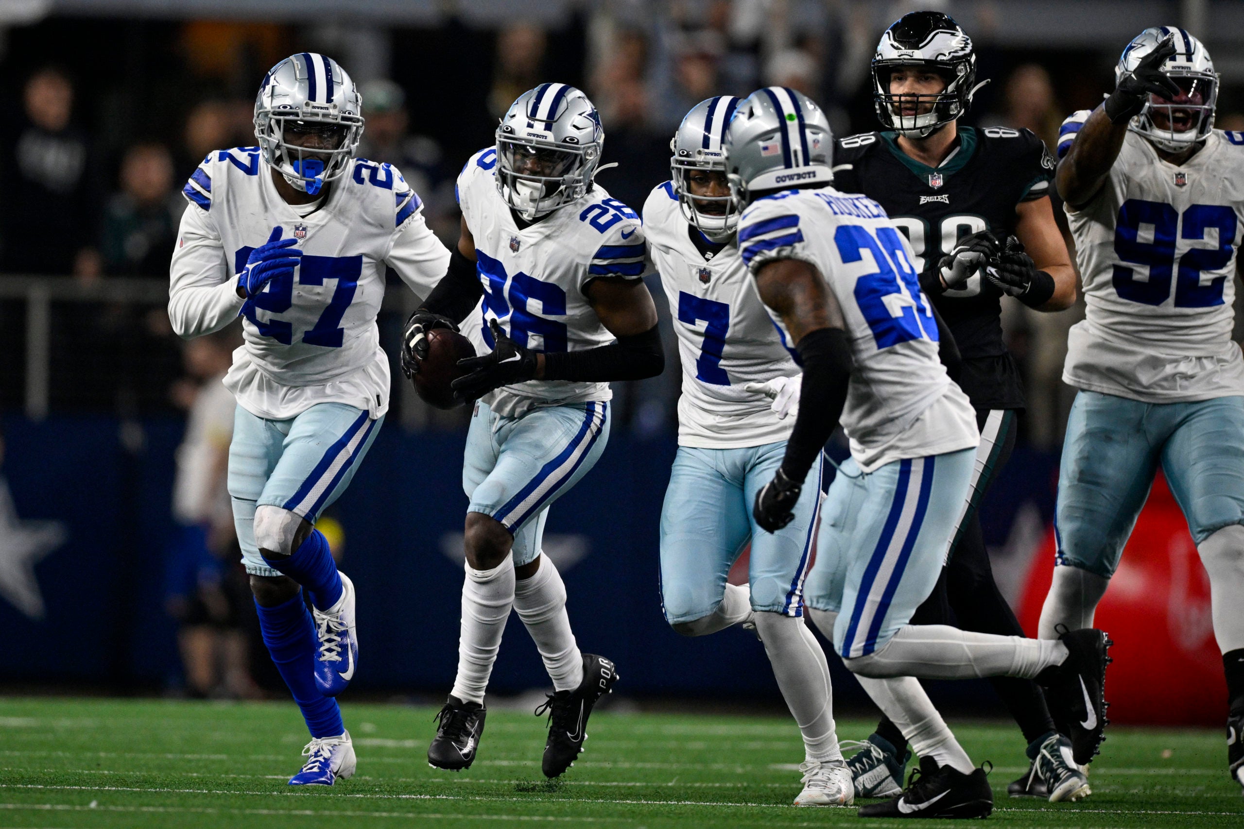 Dec 24, 2022; Arlington, Texas, USA; Dallas Cowboys safety Jayron Kearse (27) and cornerback DaRon Bland (26) and cornerback Trevon Diggs (7) and safety Malik Hooker (28) celebrate after Bland recovers a Philadelphia Eagles fumble during the second half at AT&T Stadium. Mandatory Credit: Jerome Miron-USA TODAY Sports