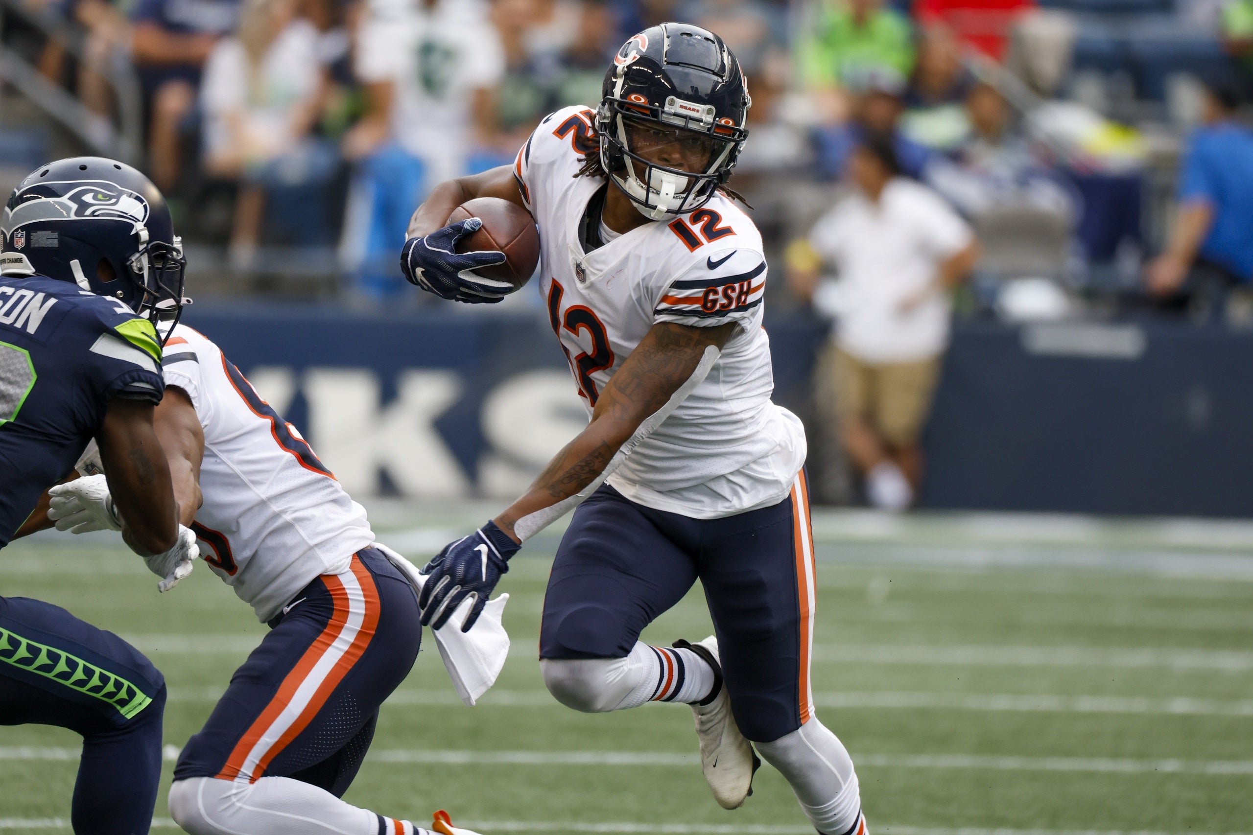 Aug 18, 2022; Seattle, Washington, USA; Chicago Bears wide receiver Velus Jones Jr. (12) runs for yards after the catch against the Seattle Seahawks during the second quarter at Lumen Field. Mandatory Credit: Joe Nicholson-USA TODAY Sports