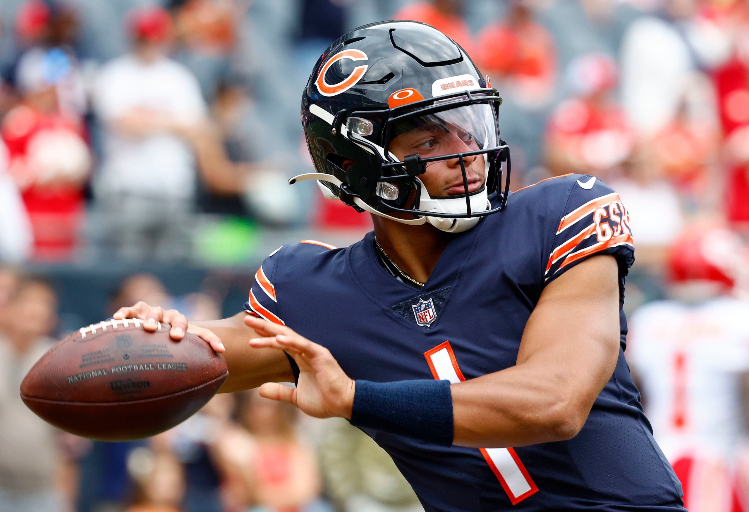 Aug 13, 2022; Chicago, Illinois, USA; Chicago Bears quarterback Justin Fields (1) practices before the game against the Kansas City Chiefs at Soldier Field. Mandatory Credit: Mike Dinovo-USA TODAY Sports