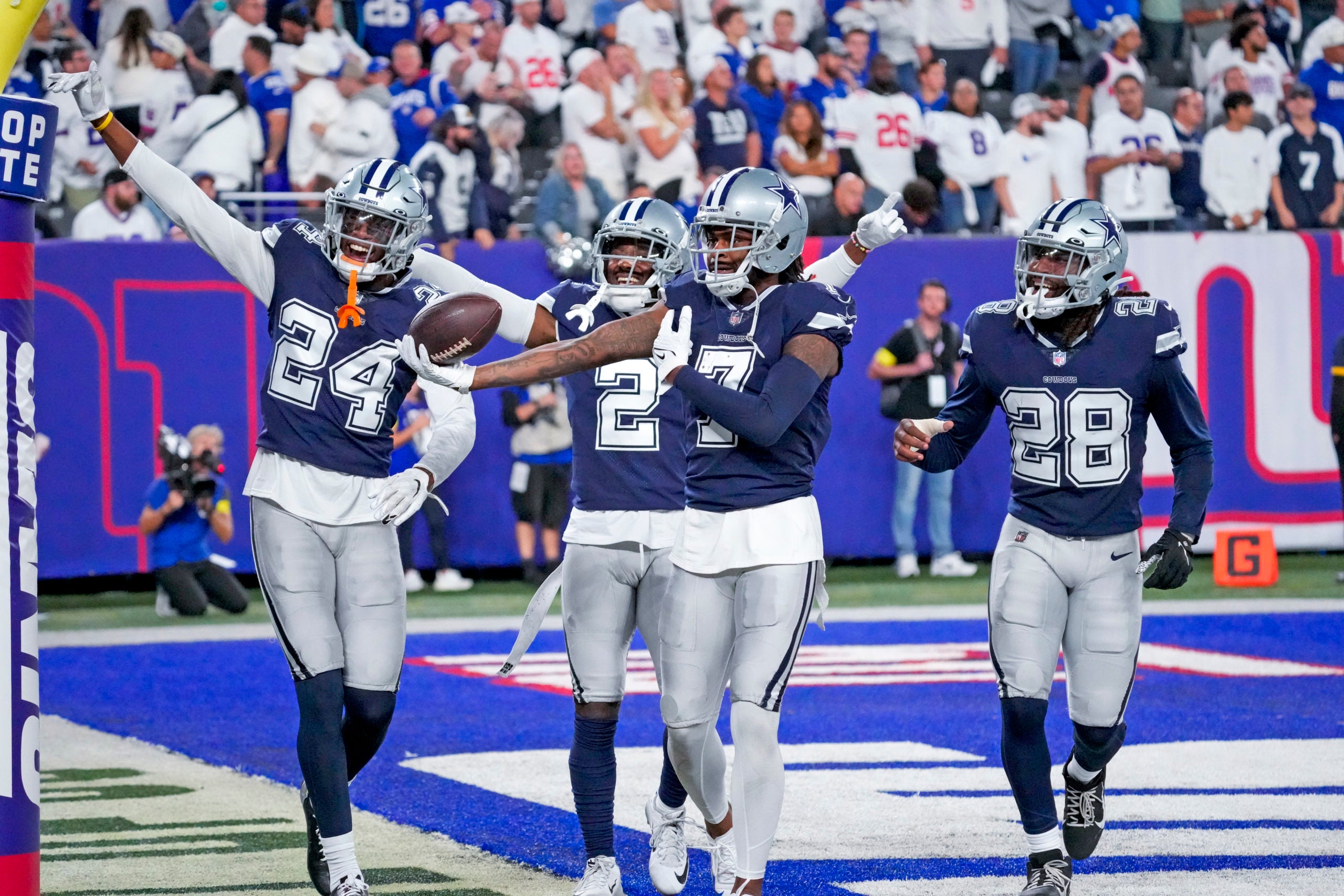Sep 26, 2022; East Rutherford, NJ, USA;  Dallas Cowboys cornerback Trevon Diggs (7) celebrates with teammates after making an interception during the fourth quarter against the New York Giants at MetLife Stadium. Mandatory Credit: Robert Deutsch-USA TODAY Sports