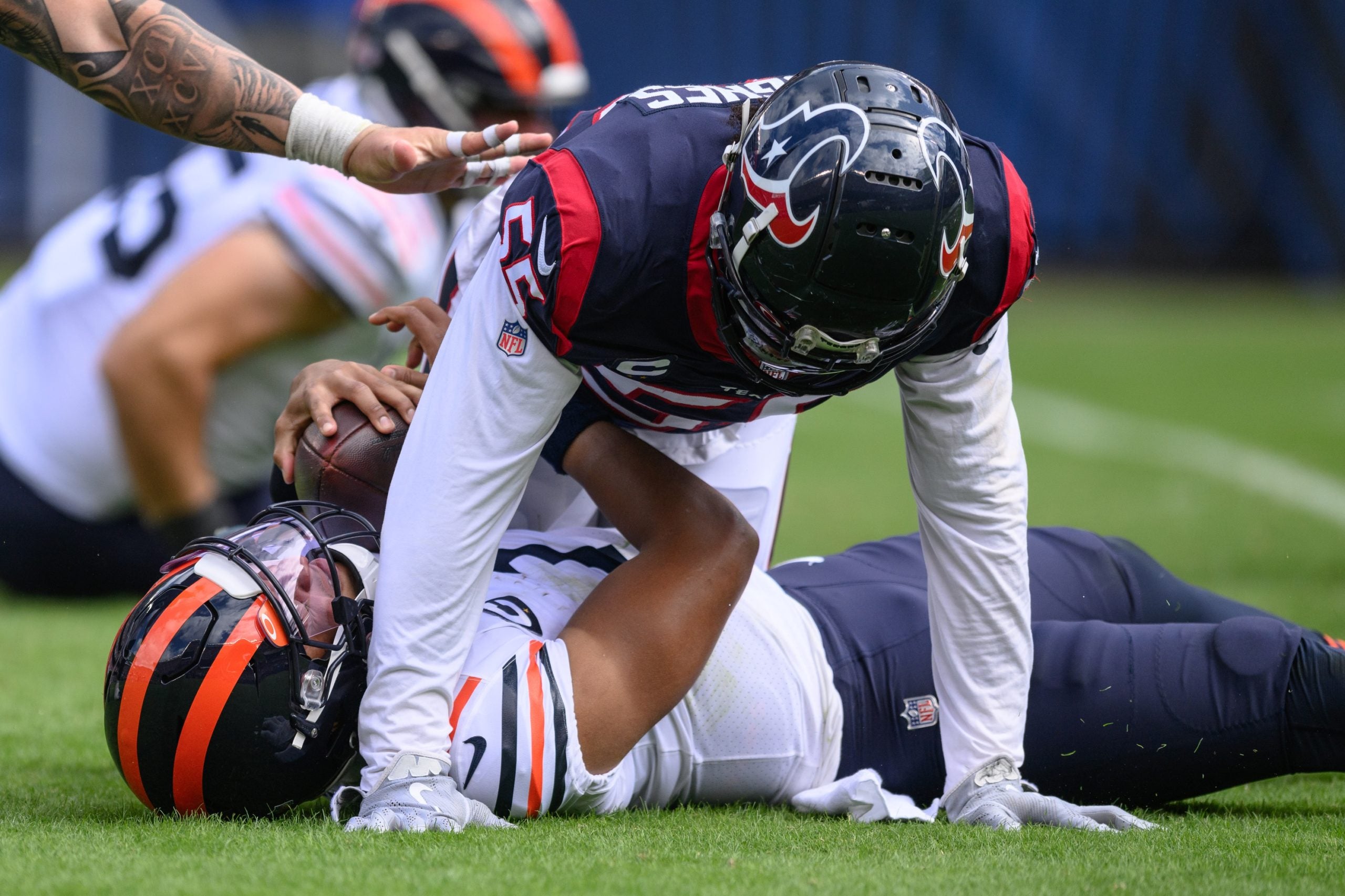 Sep 25, 2022; Chicago, Illinois, USA; Houston Texans defensive end Jerry Hughes (55) sacks Chicago Bears quarterback Justin Fields (1) in the second quarter at Soldier Field.