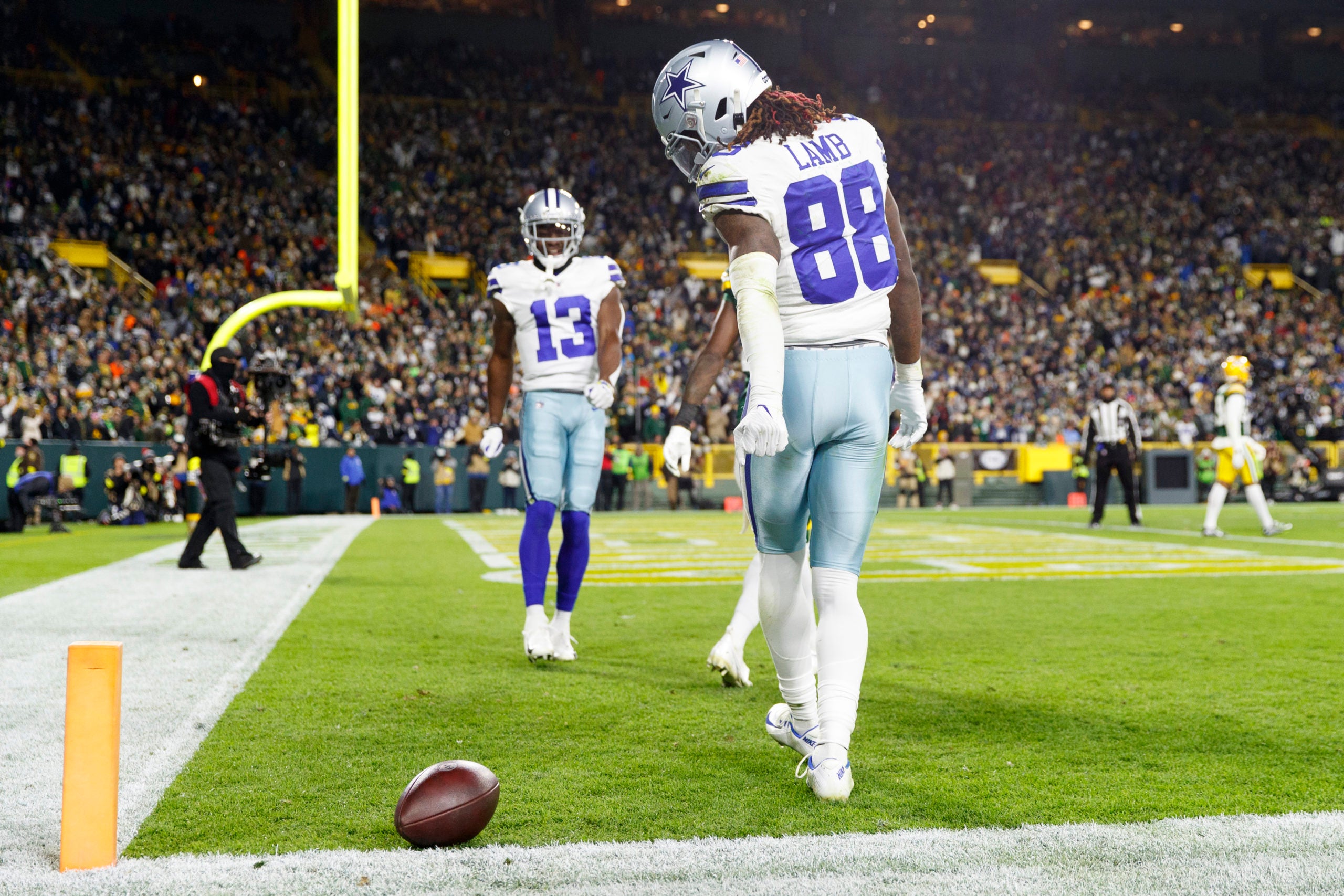 Nov 13, 2022; Green Bay, Wisconsin, USA;  Dallas Cowboys wide receiver CeeDee Lamb (88) celebrates after scoring a touchdown during the third quarter against the Green Bay Packers at Lambeau Field. Mandatory Credit: Jeff Hanisch-USA TODAY Sports