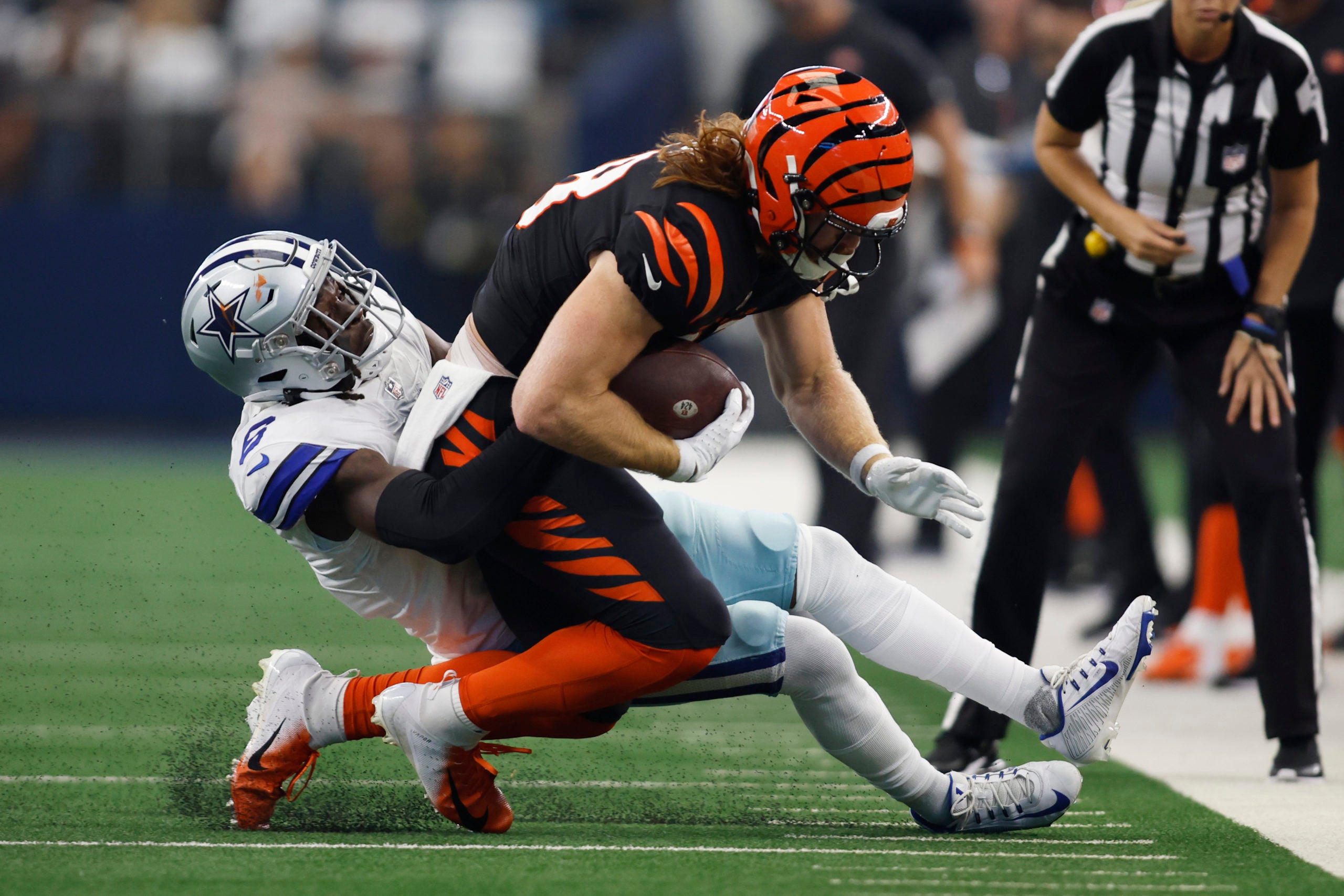 Sep 18, 2022; Arlington, Texas, USA;  Cincinnati Bengals tight end Hayden Hurst (88) is tackled by Dallas Cowboys safety Donovan Wilson (6) in the first quarter at AT&T Stadium. Mandatory Credit: Tim Heitman-USA TODAY Sports