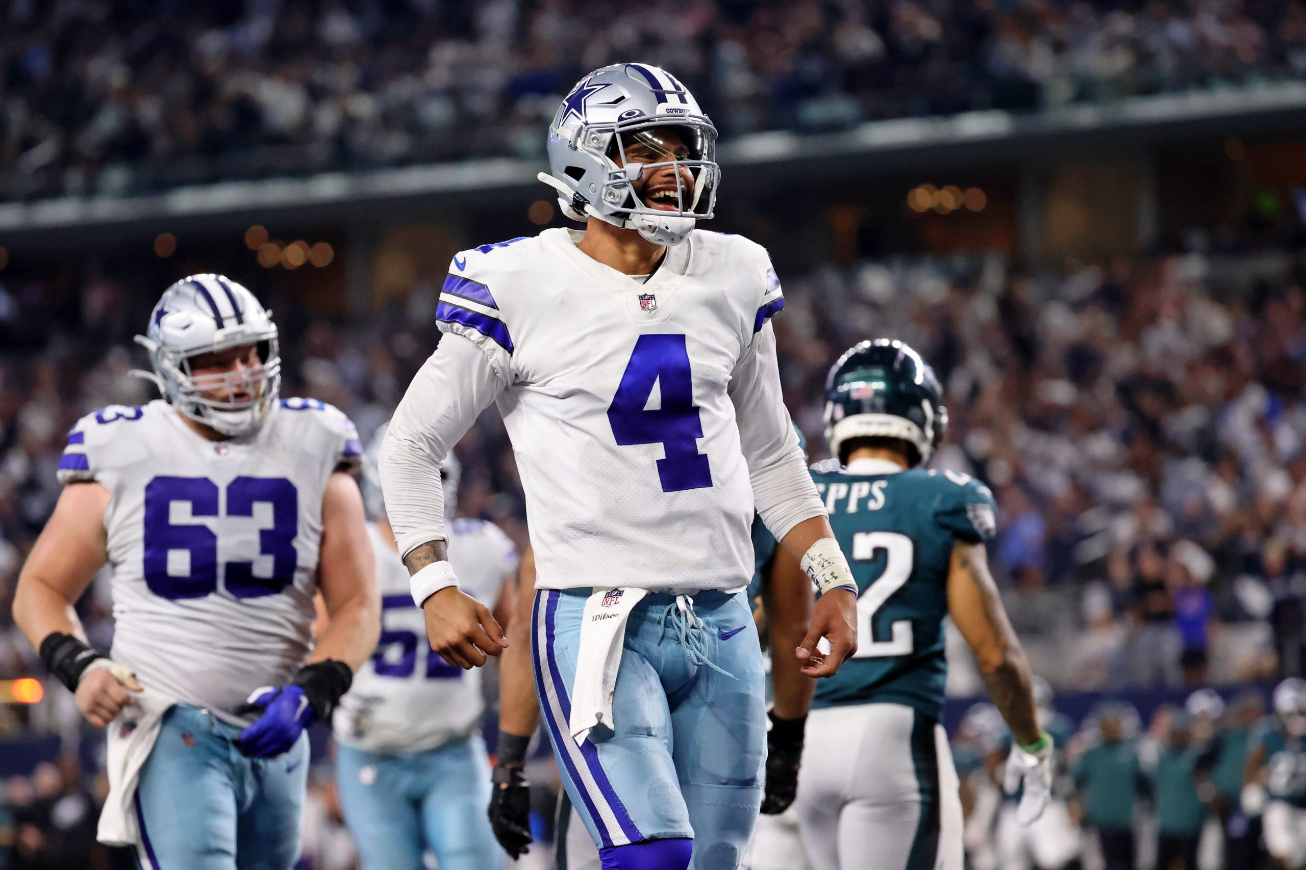 Sep 27, 2021; Arlington, Texas, USA; Dallas Cowboys quarterback Dak Prescott (4) celebrates after making a touchdown pass to tight end Dalton Schultz (not pictured) against the Philadelphia Eagles during the fourth quarter at AT&T Stadium. Mandatory Credit: Kevin Jairaj-USA TODAY Sports