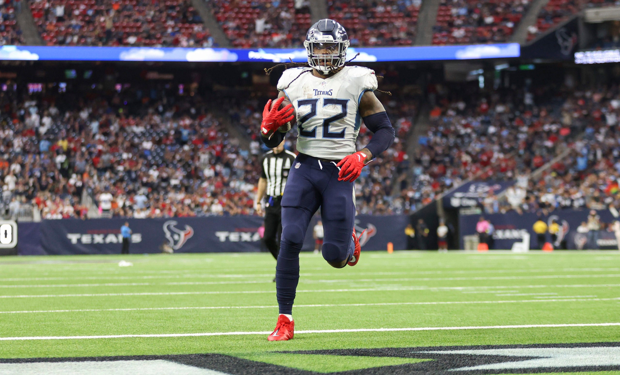 Oct 30, 2022; Houston, Texas, USA; Tennessee Titans running back Derrick Henry (22) rushes for a touchdown during the third quarter against the Houston Texans at NRG Stadium. Mandatory Credit: Troy Taormina-USA TODAY Sports
