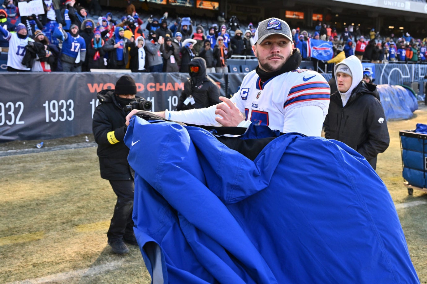 Dec 24, 2022; Chicago, Illinois, USA;  Buffalo Bills quarterback Josh Allen (17) walks off the field after defeating the Chicago Bears 35-13 at Soldier Field. Mandatory Credit: Jamie Sabau-USA TODAY Sports