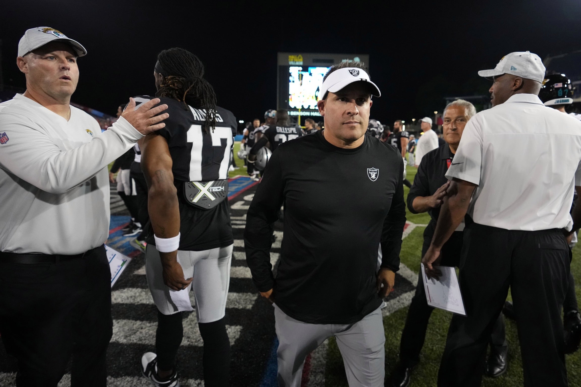 Aug 4, 2022; Canton, Ohio, USA; Las Vegas Raiders head coach Josh McDaniels and Jacksonville Jaguars head coach Doug Pederson leave the field after the Raiders defeated the Jaguars in the 2022 Hall of Fame game at Tom Benson Hall of Fame Stadium. Mandatory Credit: Kirby Lee-USA TODAY Sports