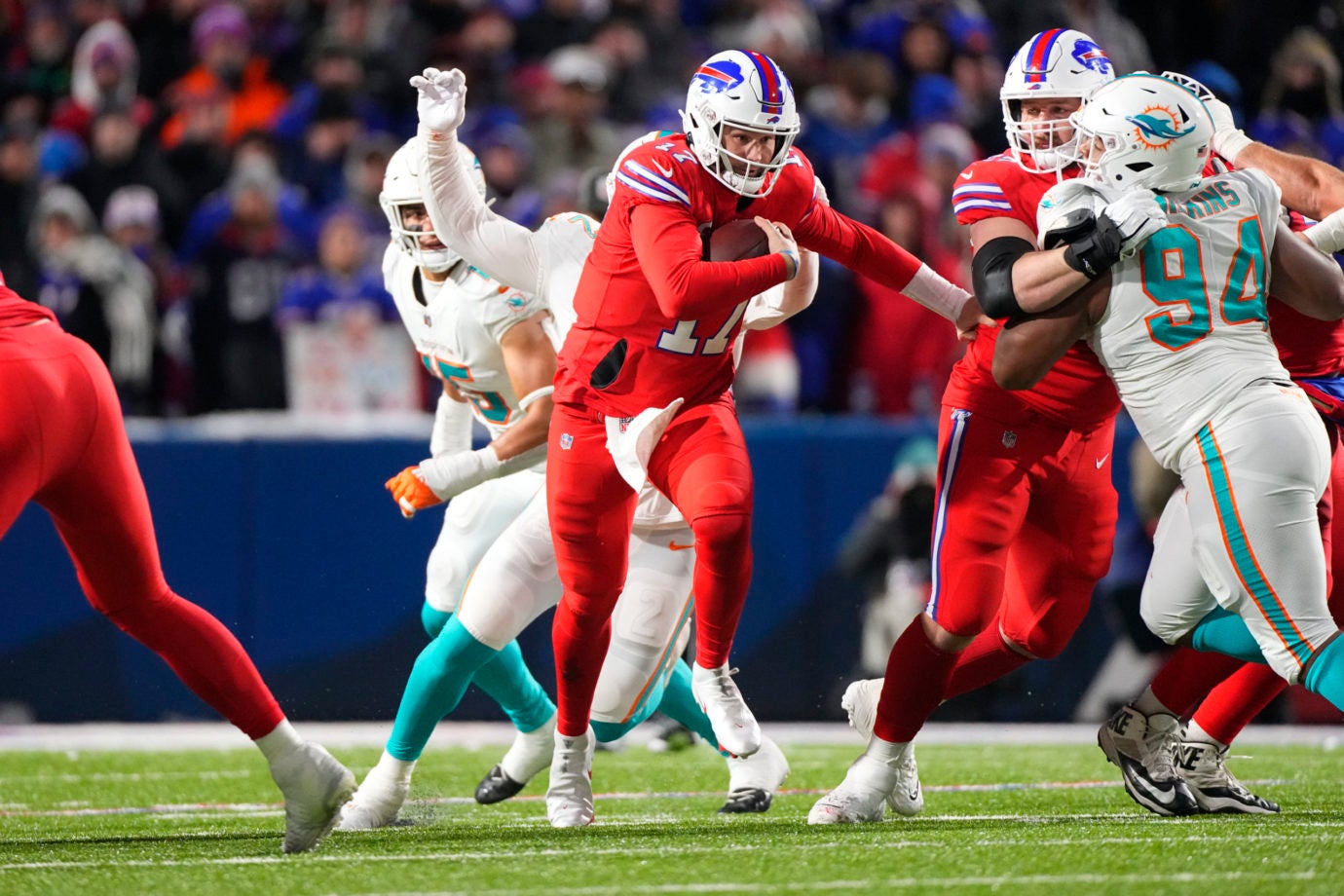 Dec 17, 2022; Orchard Park, New York, USA; Buffalo Bills quarterback Josh Allen (17) runs with the ball against the Miami Dolphins during the second half at Highmark Stadium. Mandatory Credit: Gregory Fisher-USA TODAY Sports
