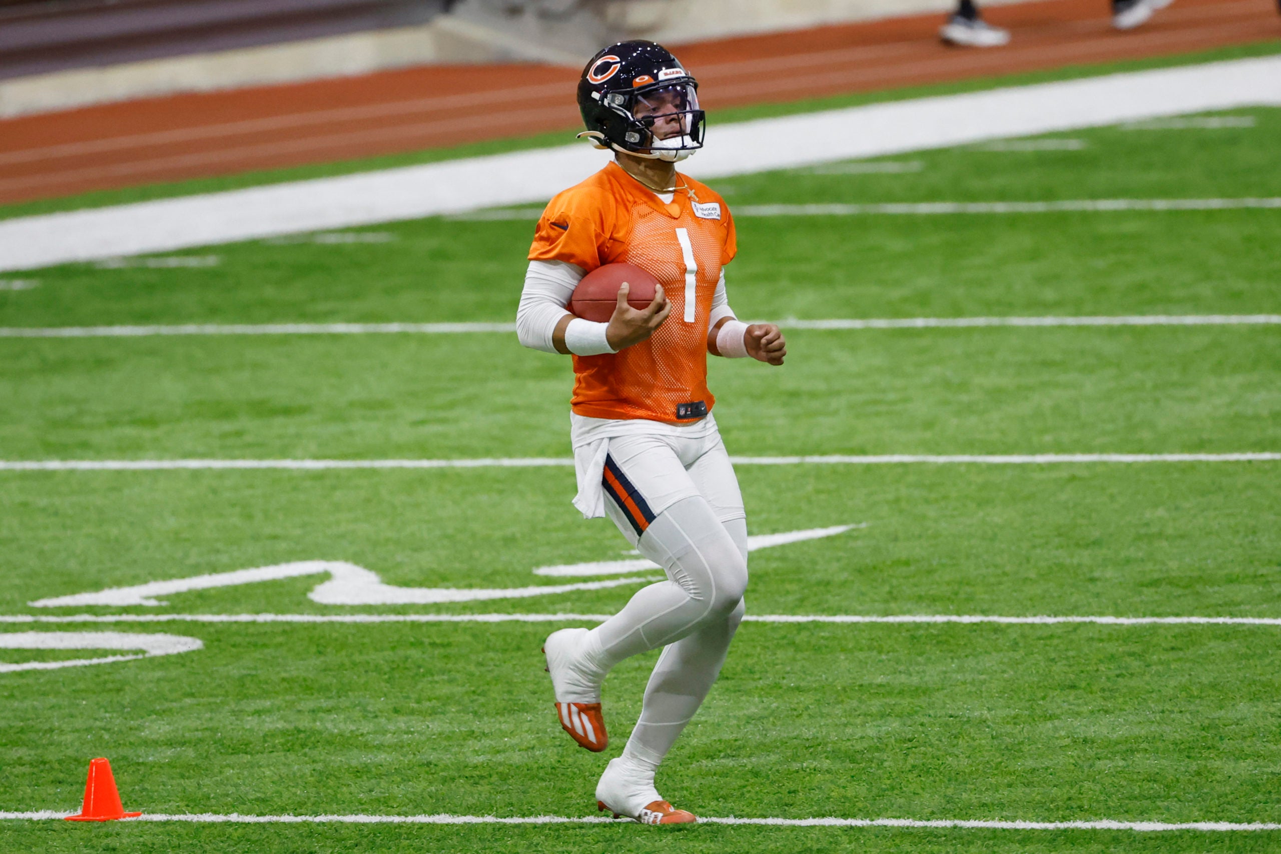 Jun 8, 2022; Lake Forest, IL, USA; Chicago Bears quarterback Justin Fields (1) warms up during organized team activities at Halas Hall. Mandatory Credit: Kamil Krzaczynski-USA TODAY Sports