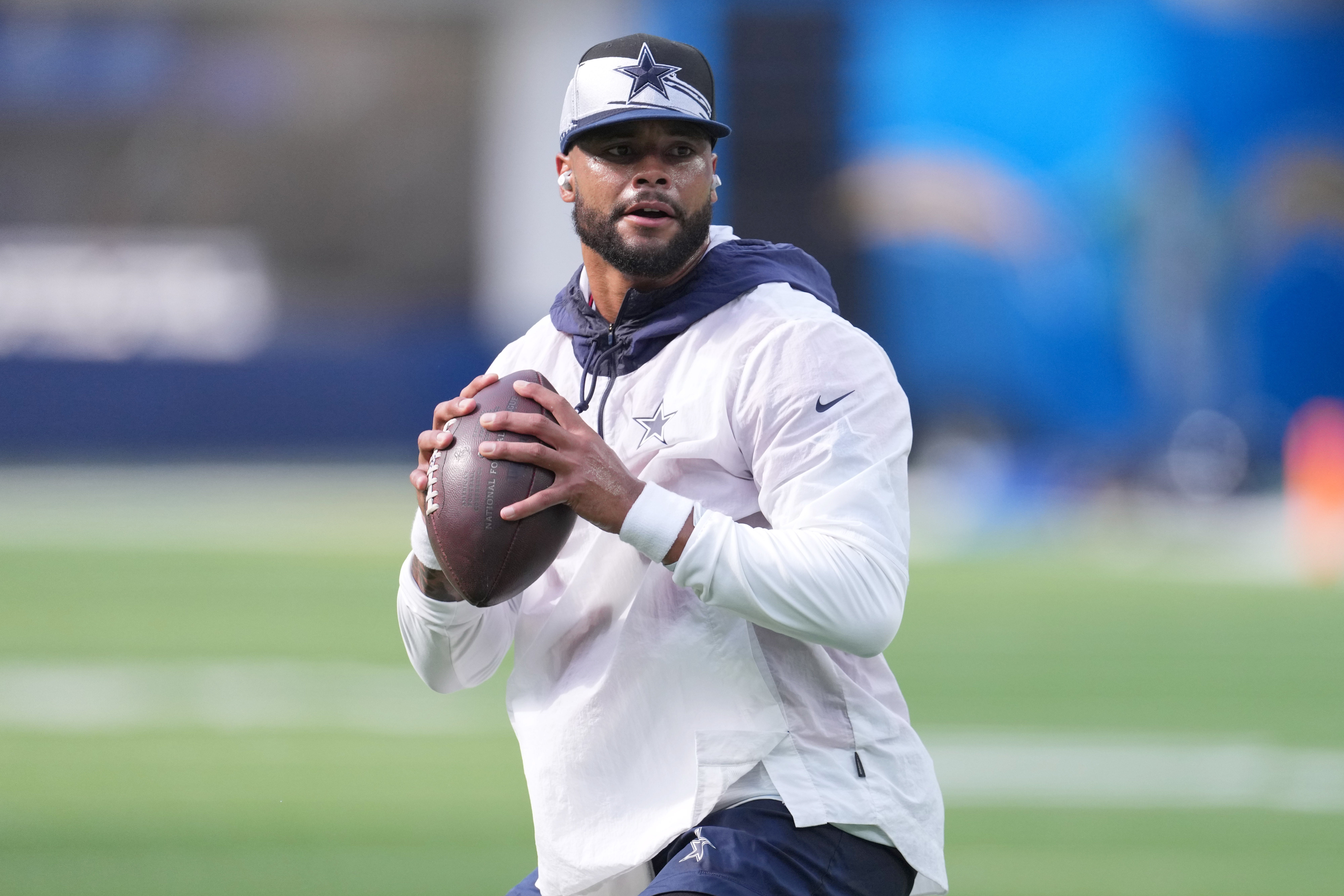 Aug 20, 2022; Inglewood, California, USA; Dallas Cowboys quarterback Dak Prescott throws the ball wearing Beats Fit Pro ear buds before the game against the Los Angeles Chargers at SoFi Stadium. Mandatory Credit: Kirby Lee-USA TODAY Sports
