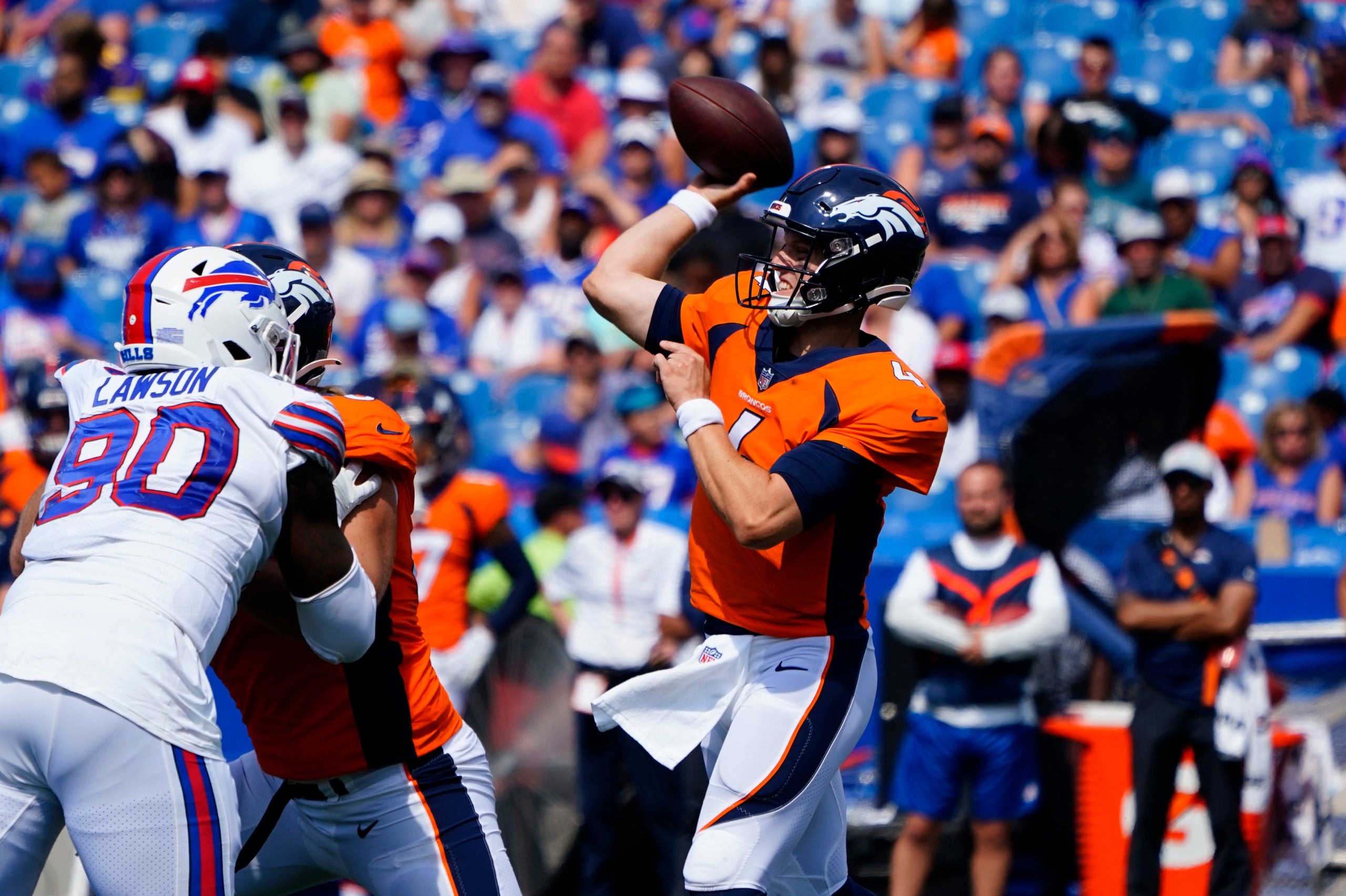 Aug 20, 2022; Orchard Park, New York, USA; Denver Broncos quarterback Brett Rypien (4) throws the ball against the Buffalo Bills during the second half at Highmark Stadium. Mandatory Credit: Gregory Fisher-USA TODAY Sports