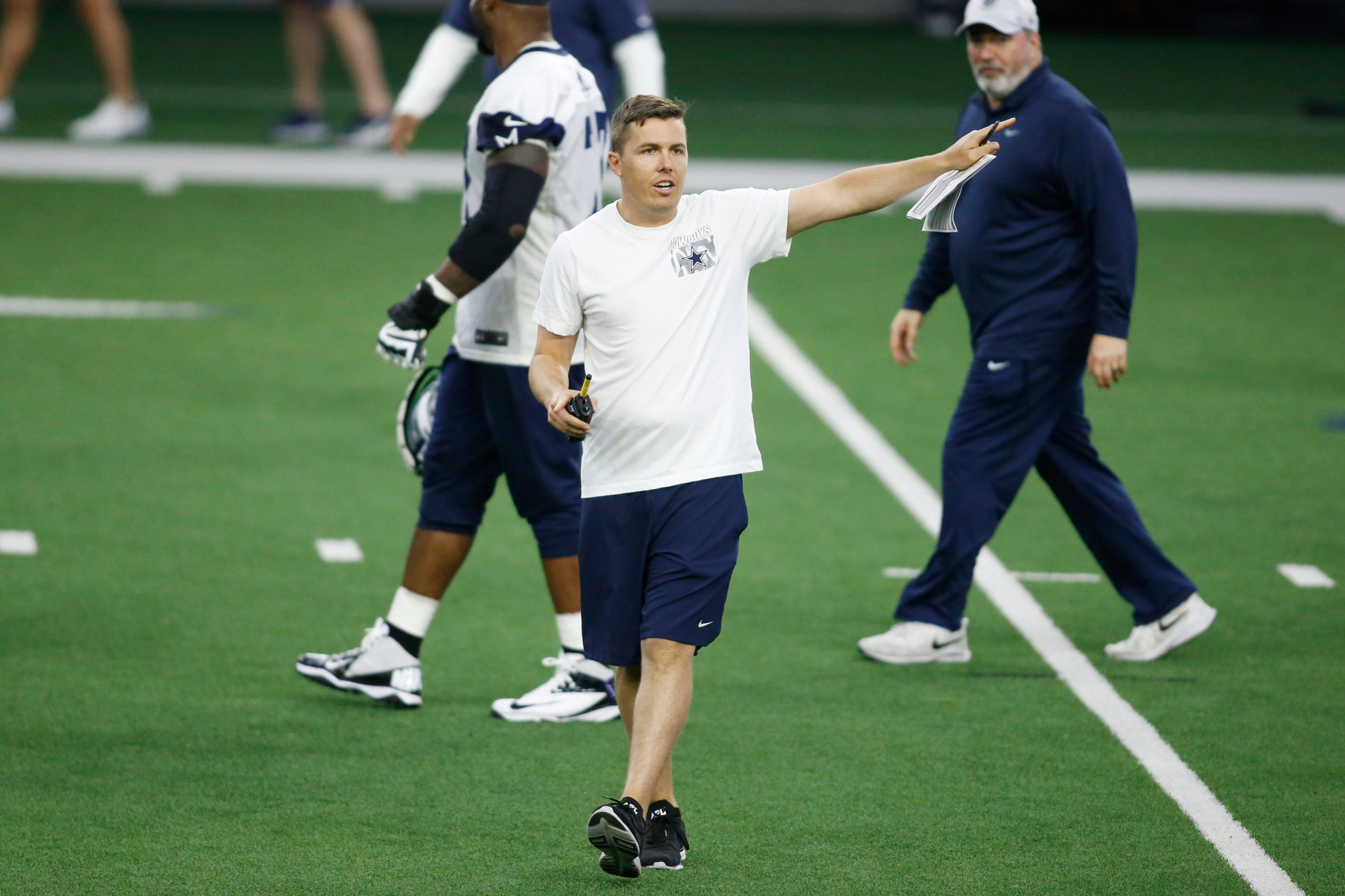 Jun 14, 2022; Arlington, Texas, USA;  Dallas Cowboys offensive coordinator Kellen Moore on the field during minicamp at the Ford Center at the Star Training Facility in Frisco, Texas. Mandatory Credit: Tim Heitman-USA TODAY Sports