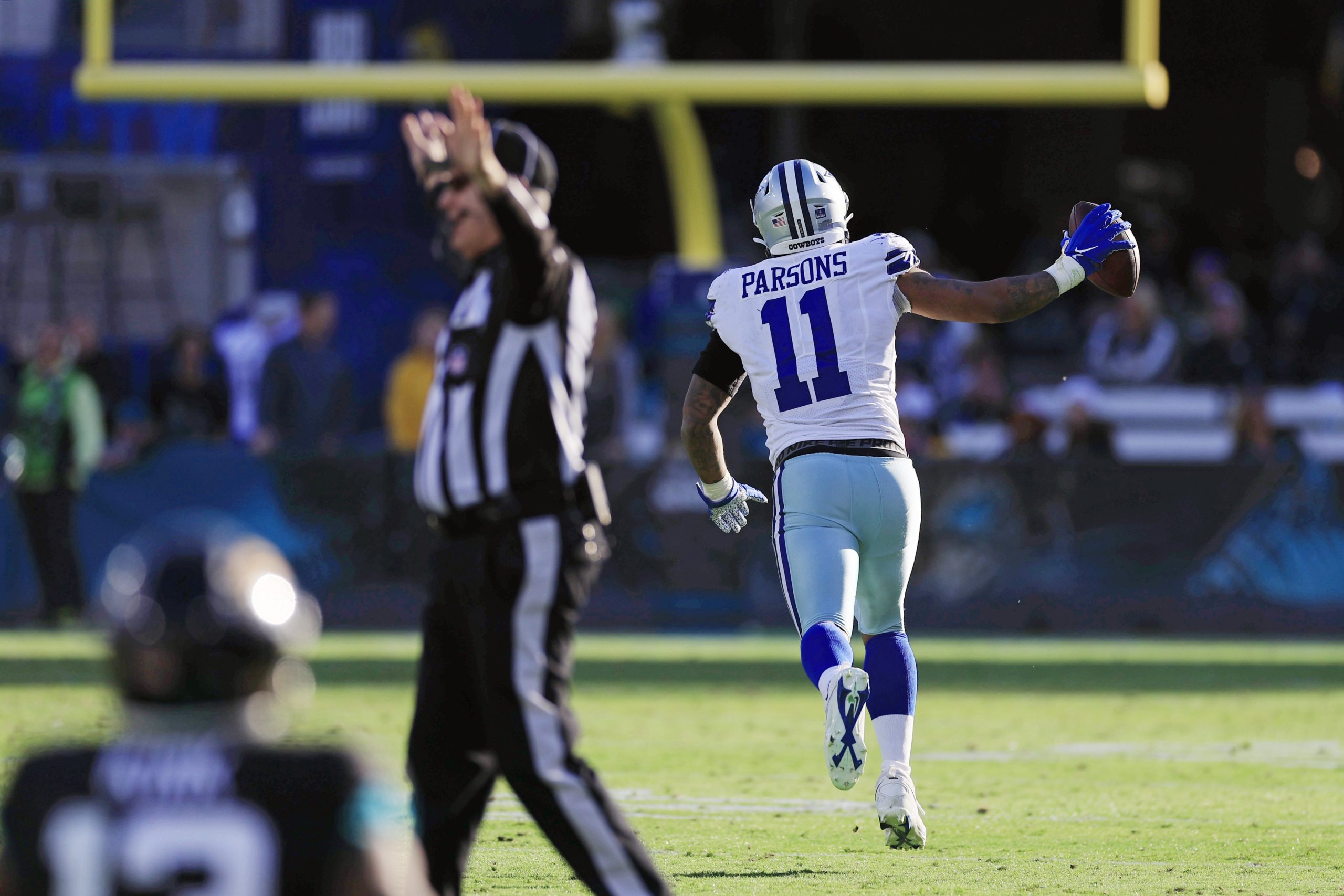 Dallas Cowboys linebacker Micah Parsons (11) picks up a fumble during the fourth quarter of a regular season NFL football matchup Sunday, Dec. 18, 2022 at TIAA Bank Field in Jacksonville. The Jacksonville Jaguars edged the Dallas Cowboys 40-34 in overtime. [Corey Perrine/Florida Times-Union] Jki 121822 Cowboys Jags Cp 47