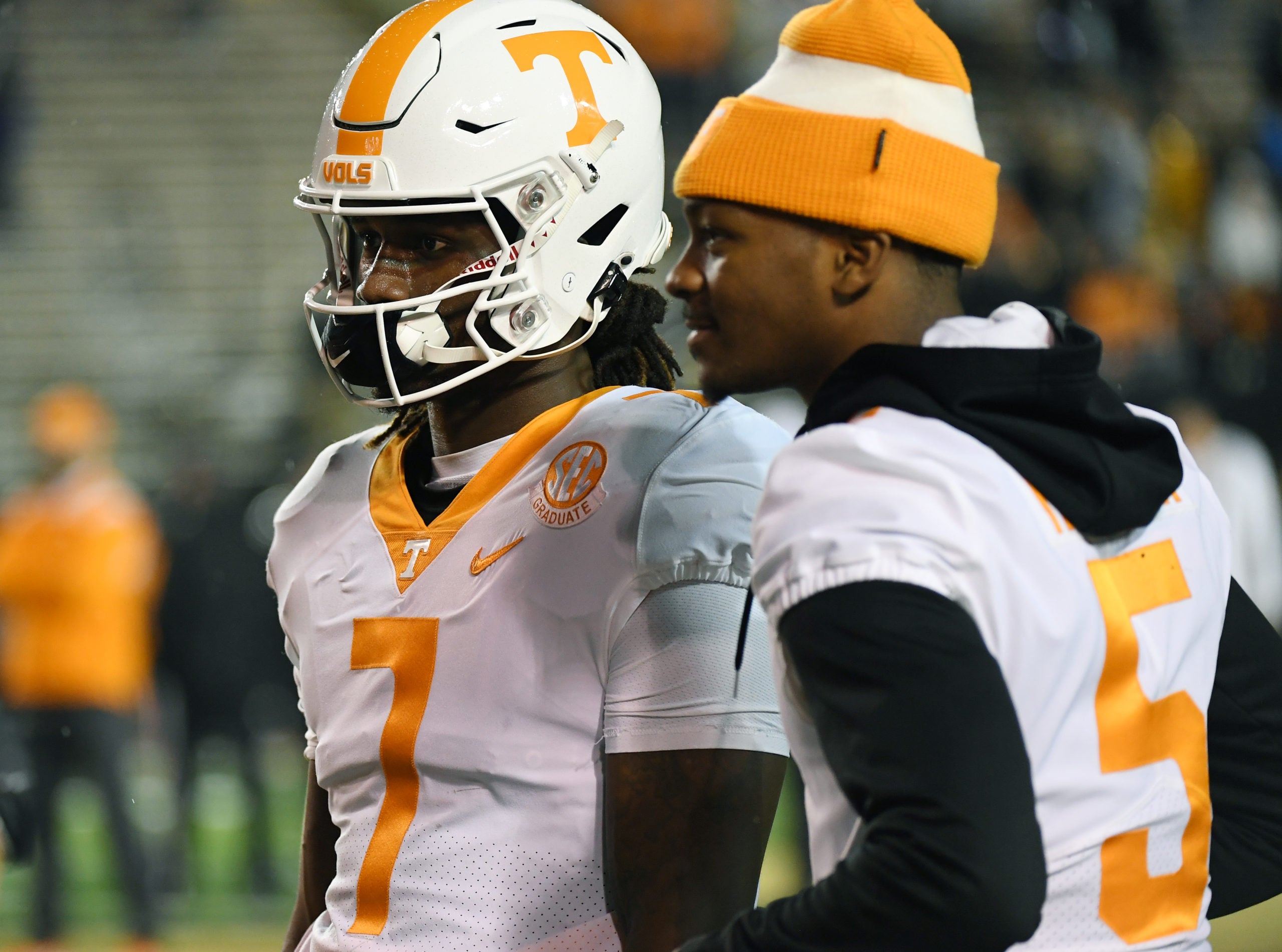 Nov 26, 2022; Nashville, Tennessee, USA; Tennessee Volunteers quarterback Joe Milton III (7) talks with quarterback Hendon Hooker (5) before the game against the Vanderbilt Commodores at FirstBank Stadium. Mandatory Credit: Christopher Hanewinckel-USA TODAY Sports