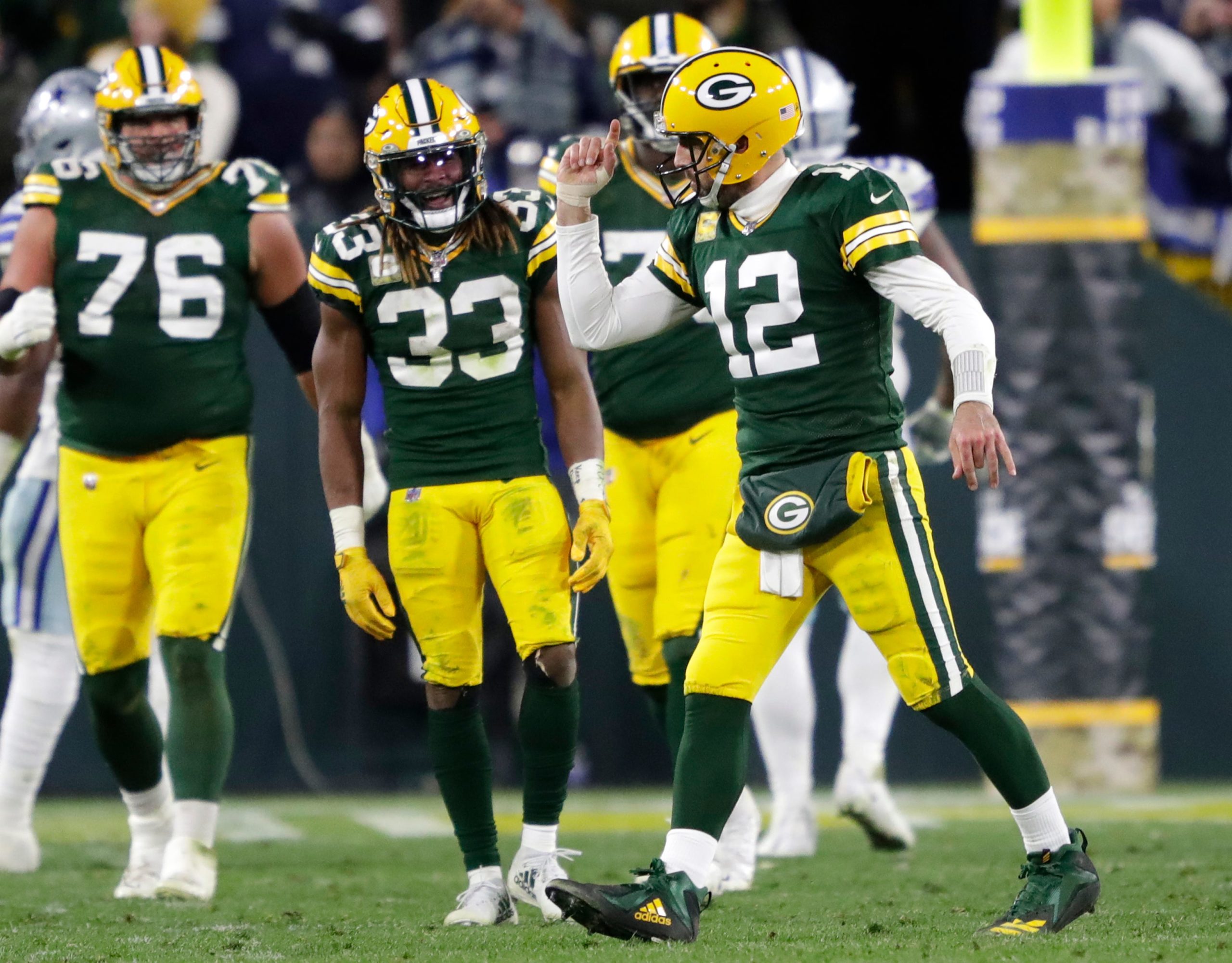 Green Bay Packers quarterback Aaron Rodgers (12) celebrates throwing a touchdown to wide receiver Christian Watson (9) against the Dallas Cowboys during their football game Sunday, November 13, at Lambeau Field in Green Bay, Wis. Dan Powers/USA TODAY NETWORK-Wisconsin Apc Packvscowboys 1113221710djp