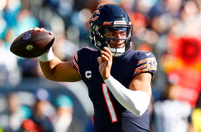Chicago Bears QB Justin Fields quarterback comparisons Michael Vick Buffalo Bills QB Josh Allen stats 19 starts touchdowns interceptions numbers rookie NFL football rankings news
